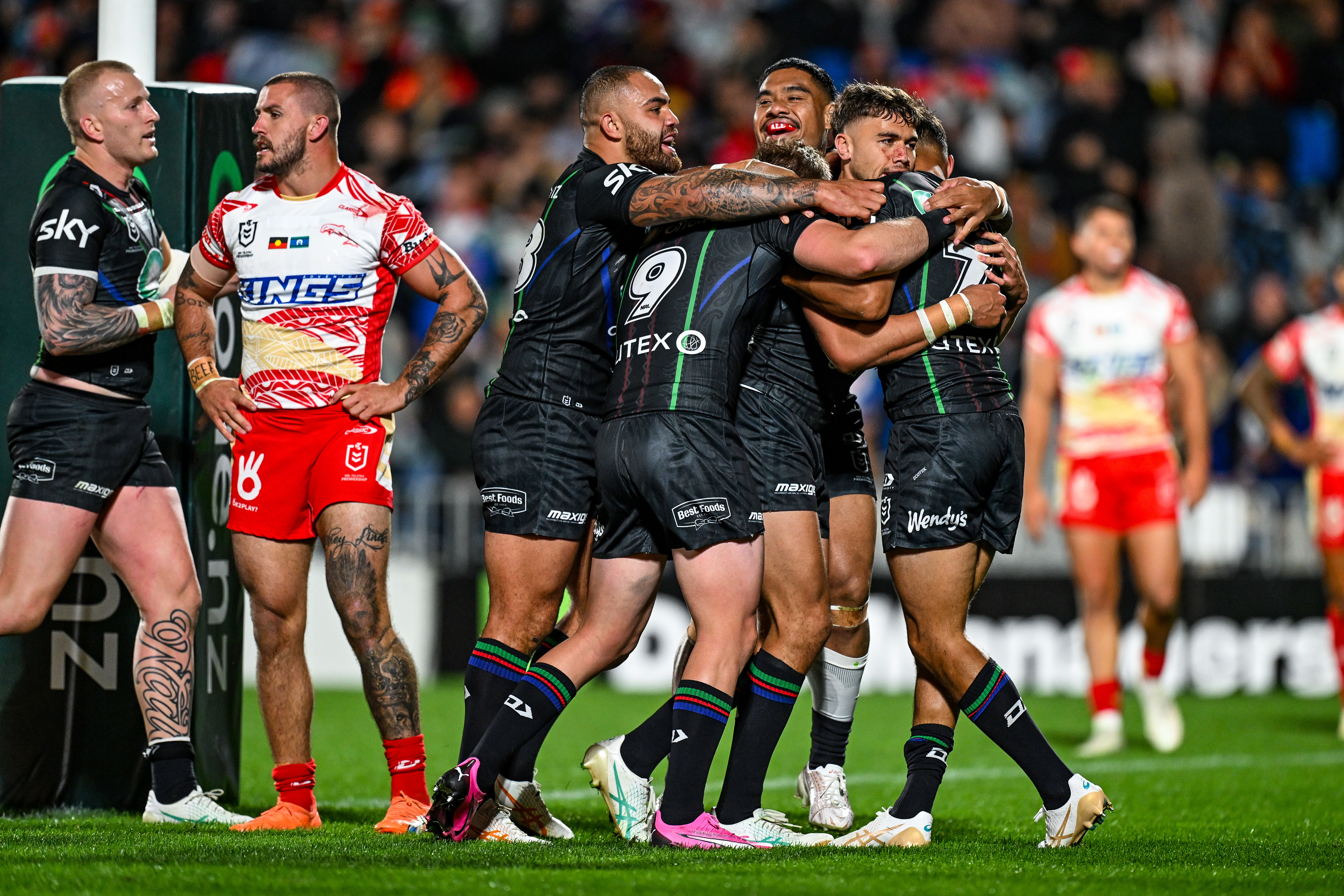 The Warriors celebrate a try for Te Maire Martin against the Dolphins. Photo / Photosport