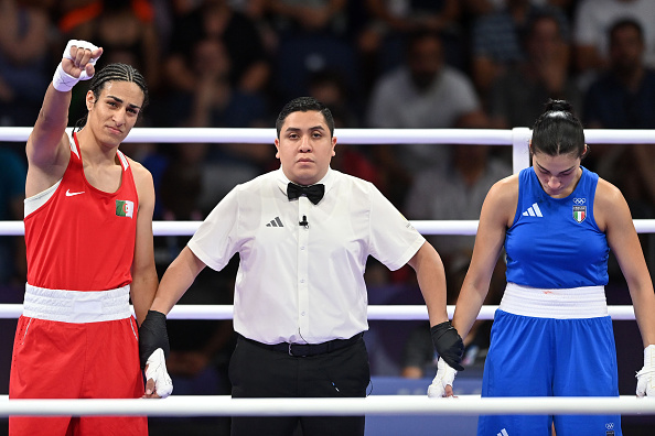 Algeria's Imane Khelif raises her arm after defeating Angela Carini, of Italy, in the Olympics Women's 66kg preliminary round boxing match. Photo / Getty Images