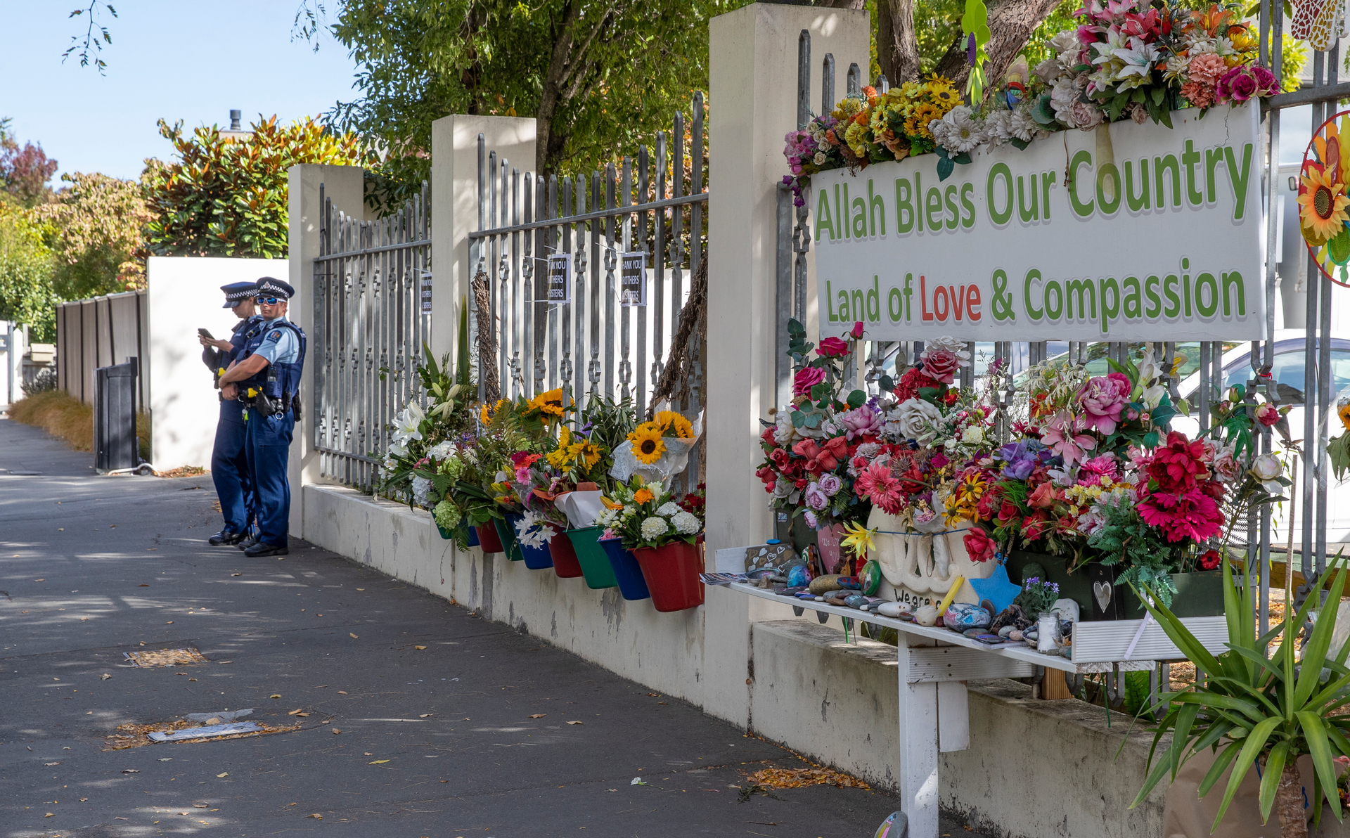 Police officers keep watch outside the Al Noor Mosque in Christchurch a year after the terrorist attack. Photo / Mark Mitchell