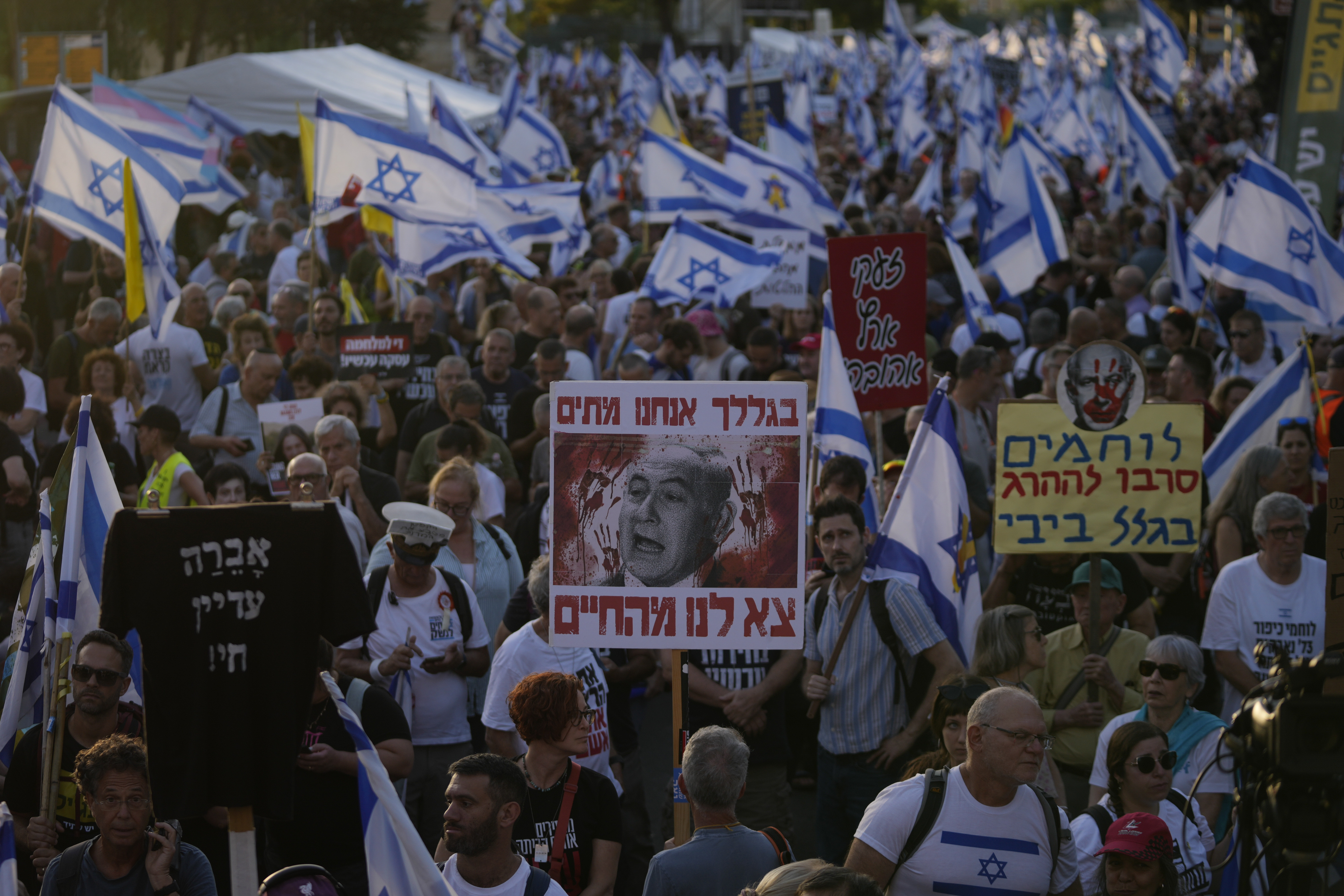 People take part in a protest against Israeli Prime Minister Benjamin Netanyahu's government, demanding new elections and the release of the hostages held in the Gaza Strip. Photo / AP