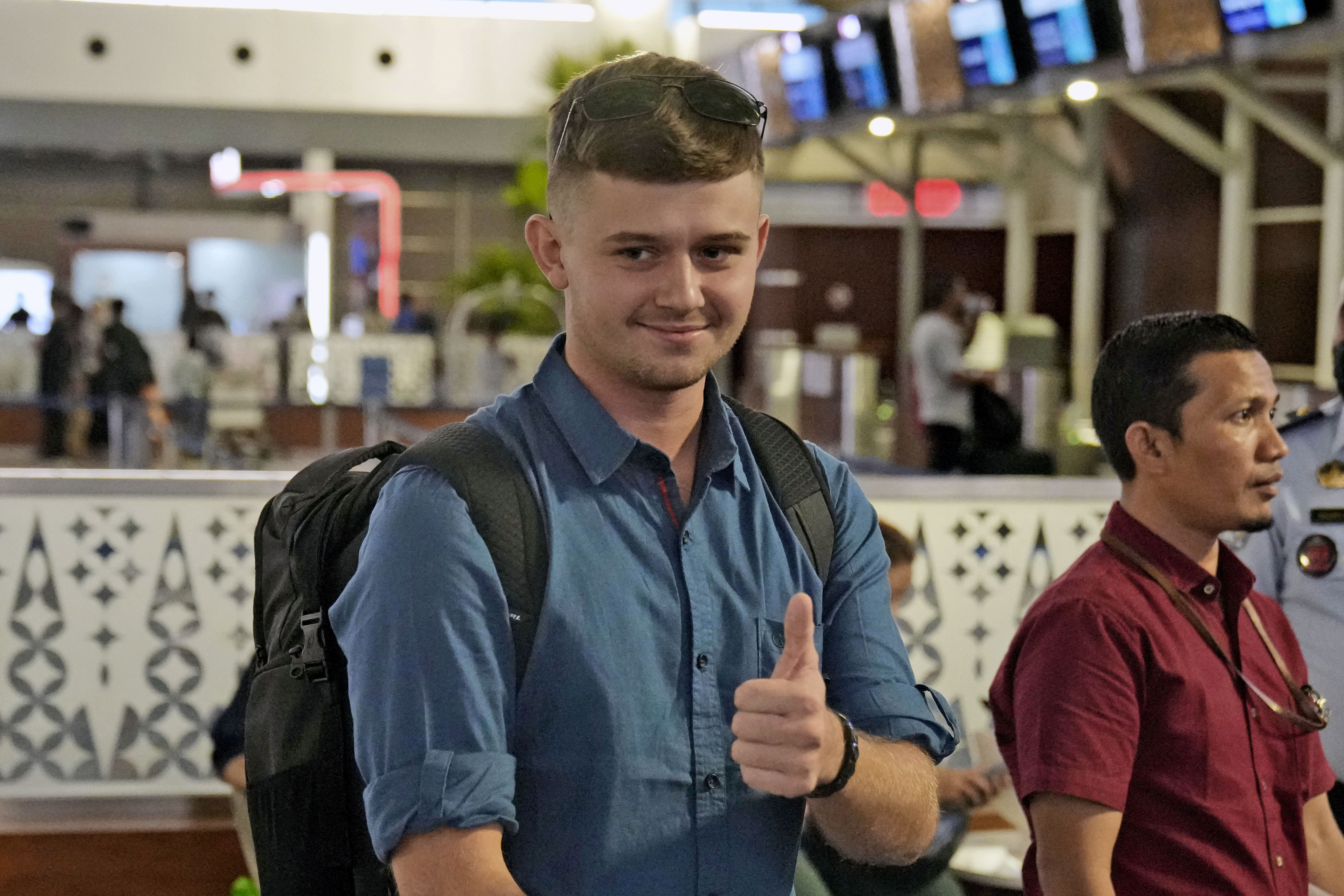 Australian national Bodhi Mani Risby-Jones from Queensland gives a thumb-up as he waits to be deported from Soekarno-Hatta International Airport in Tangerang, Indonesia, Photo / AP, Dita Alangkara.