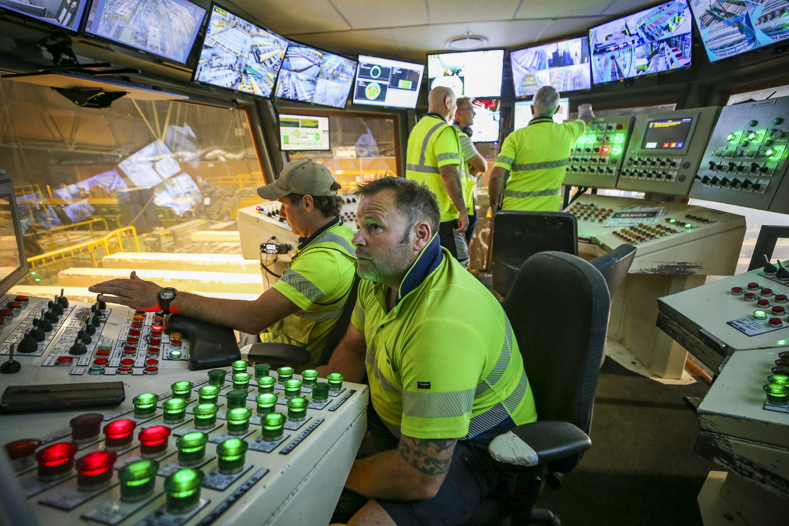 Chris Bewick and Ryan Powell oversee the secondary operations tier while operations manager Phil Beamish White, Kerry Dash and Tony O’Keefe watch the new log in-feed via operational cameras. Photo / Paul Taylor