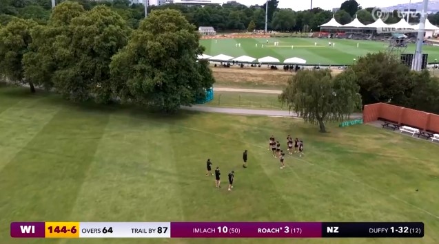 A TVNZ drone camera passes over a group of Christ's College students, prompting a comment from commentator Scotty Stevenson. Screengrab / TVNZ