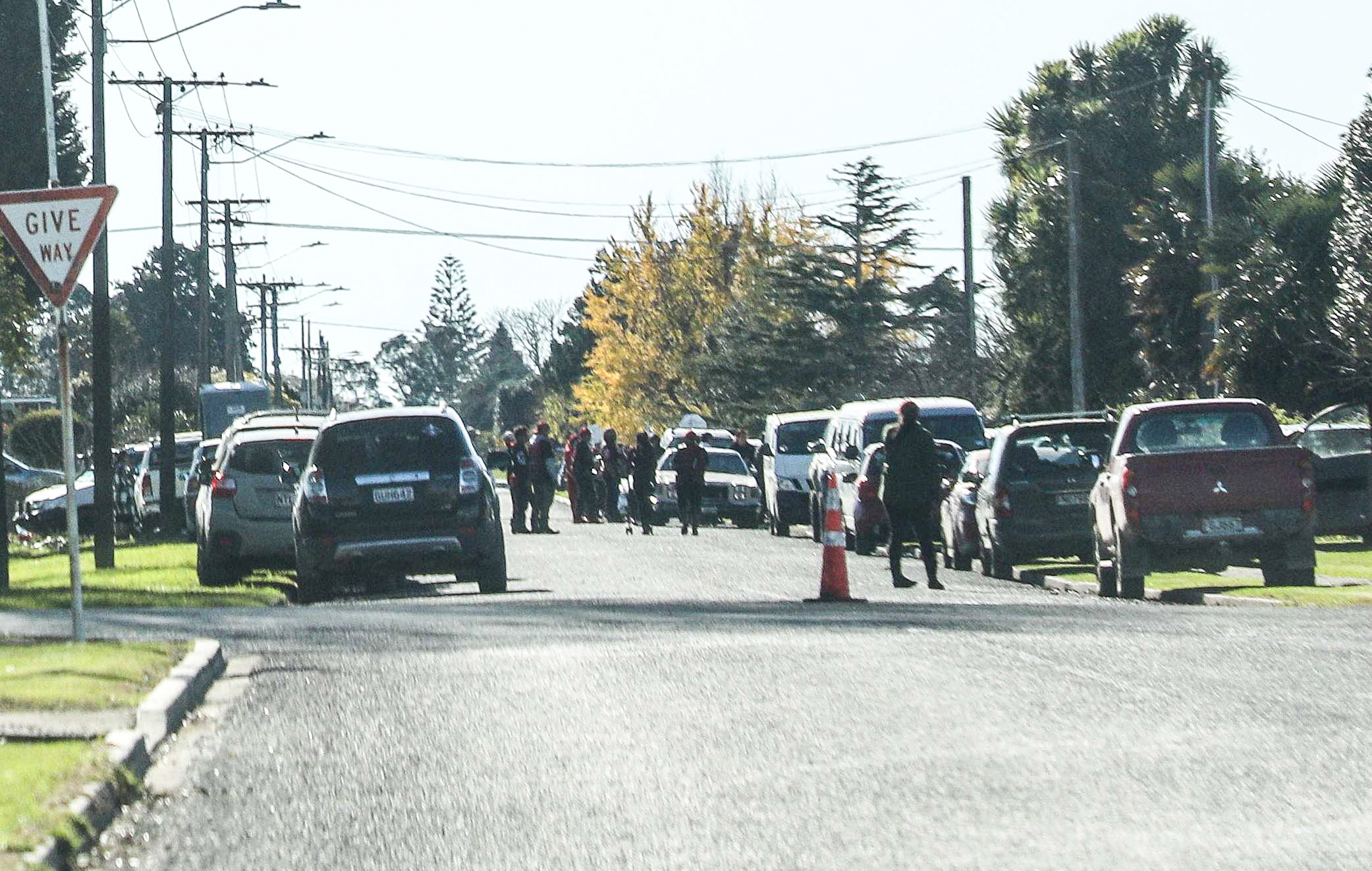 Members of the Mongrel Mob Barbarians line Buchanan St in Ōpōtiki for the tangi of leader Steven Rota Taiatini, who was killed on St John St on June 9. Photo / NZME