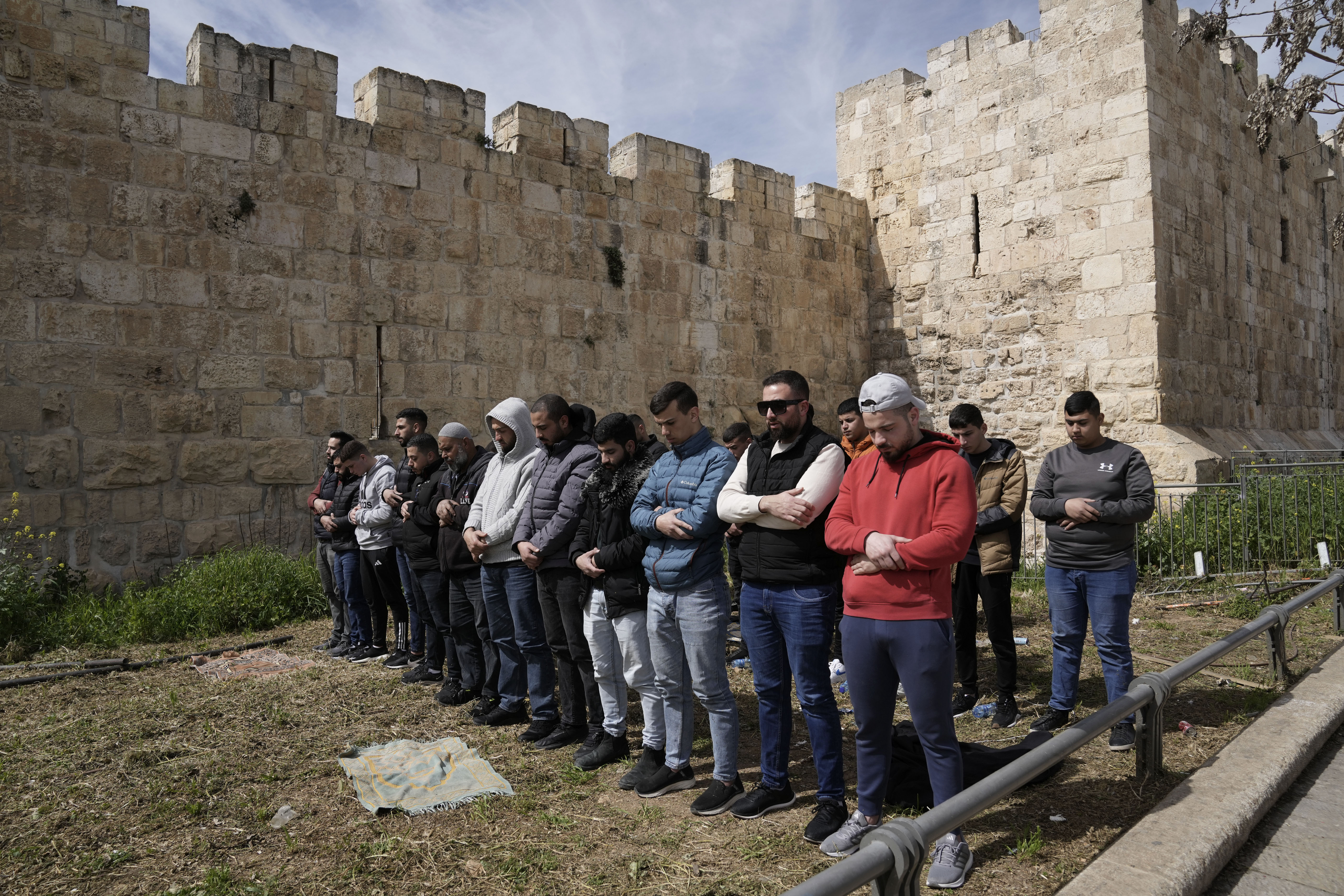 Palestinian Muslims pray outside of the walls of the Old City of Jerusalem after Israeli police denied their entry to the Al-Aqsa Mosque compound for Friday prayers. Photo / AP