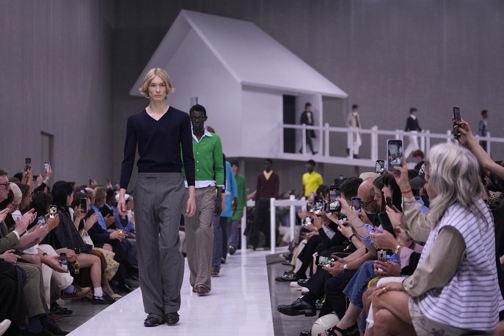 Models walk the runway at the Prada spring-summer 2025 collection in Milan. Photo / AP