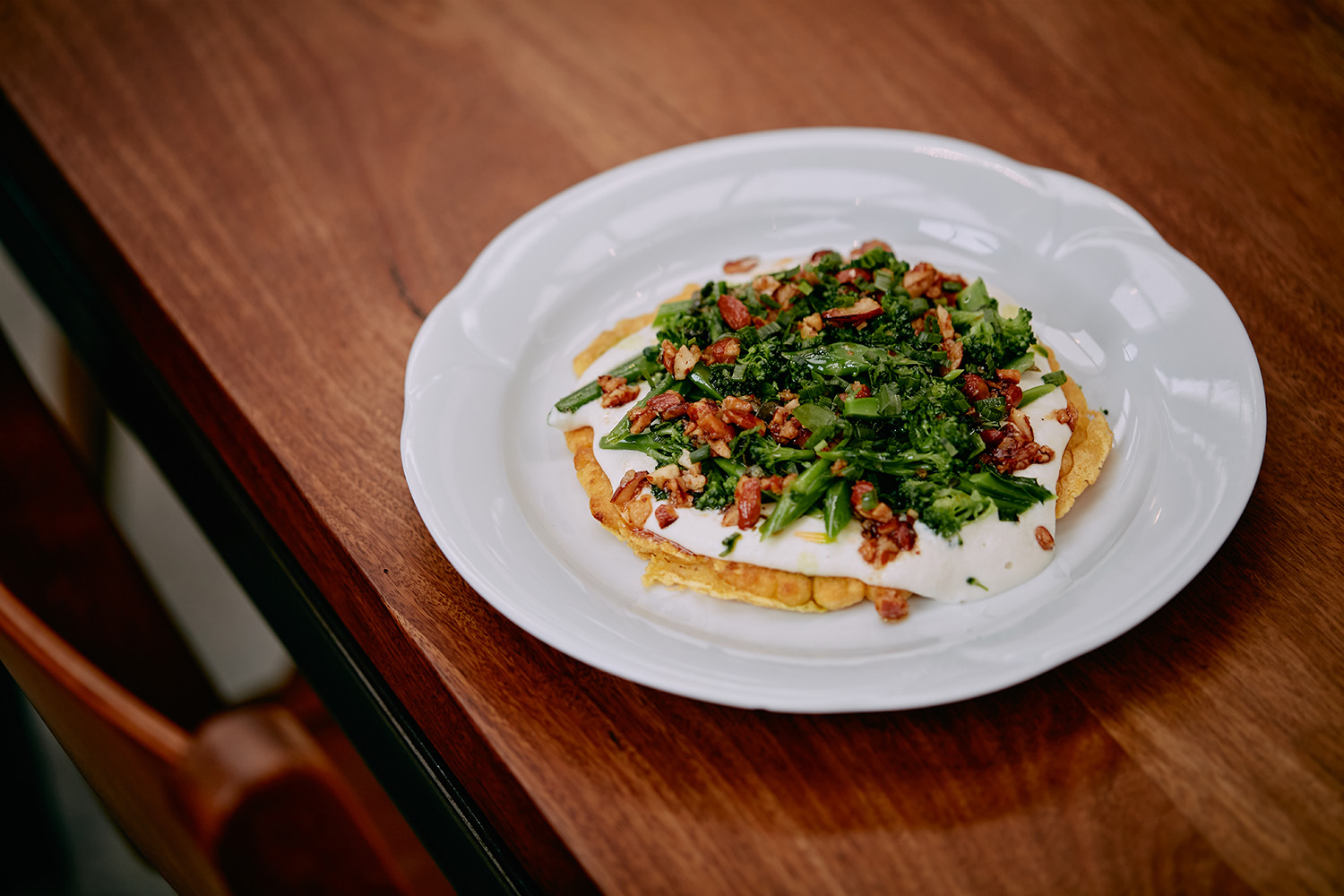 The chickpea socca, sprouting broccoli, almond and salsa verde. Photo / Babiche Martens