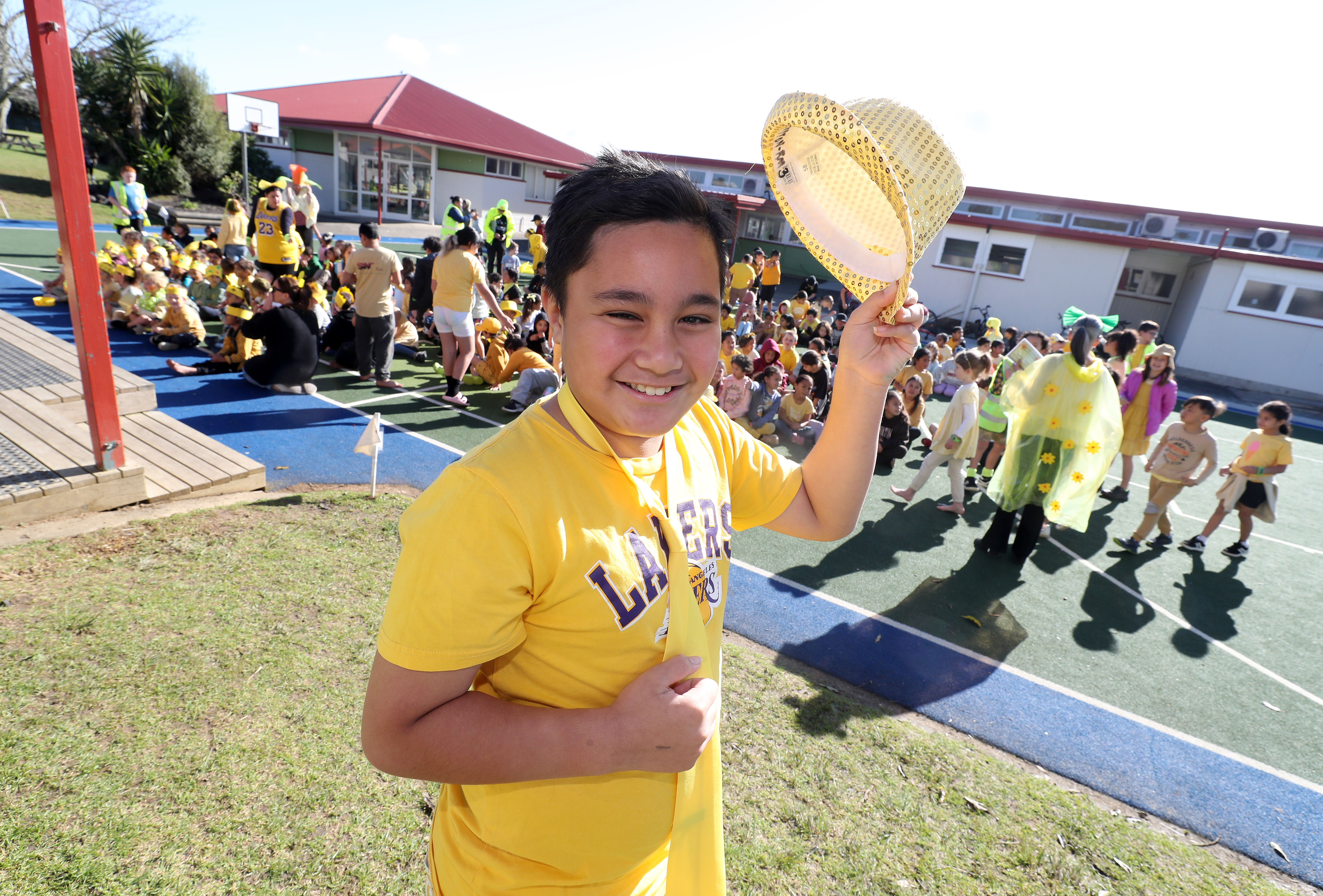 Parade leader Dayton Matthews, 9, proudly sports his yellow attire. Photo / Michael Cunningham