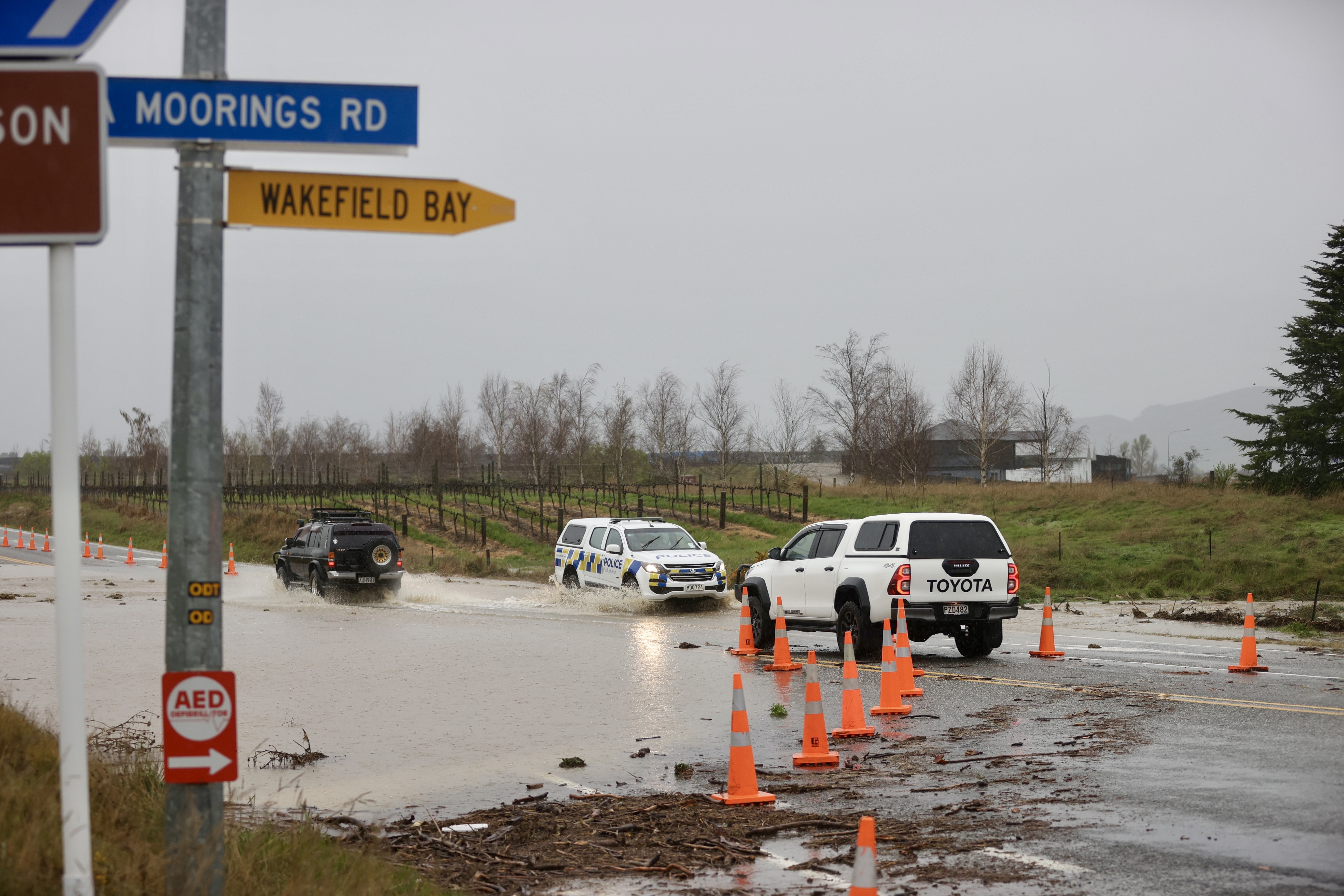 Flooding on the Luggate Cromwell Rd at Pisa Moorings this morning. Photo / George Heard
