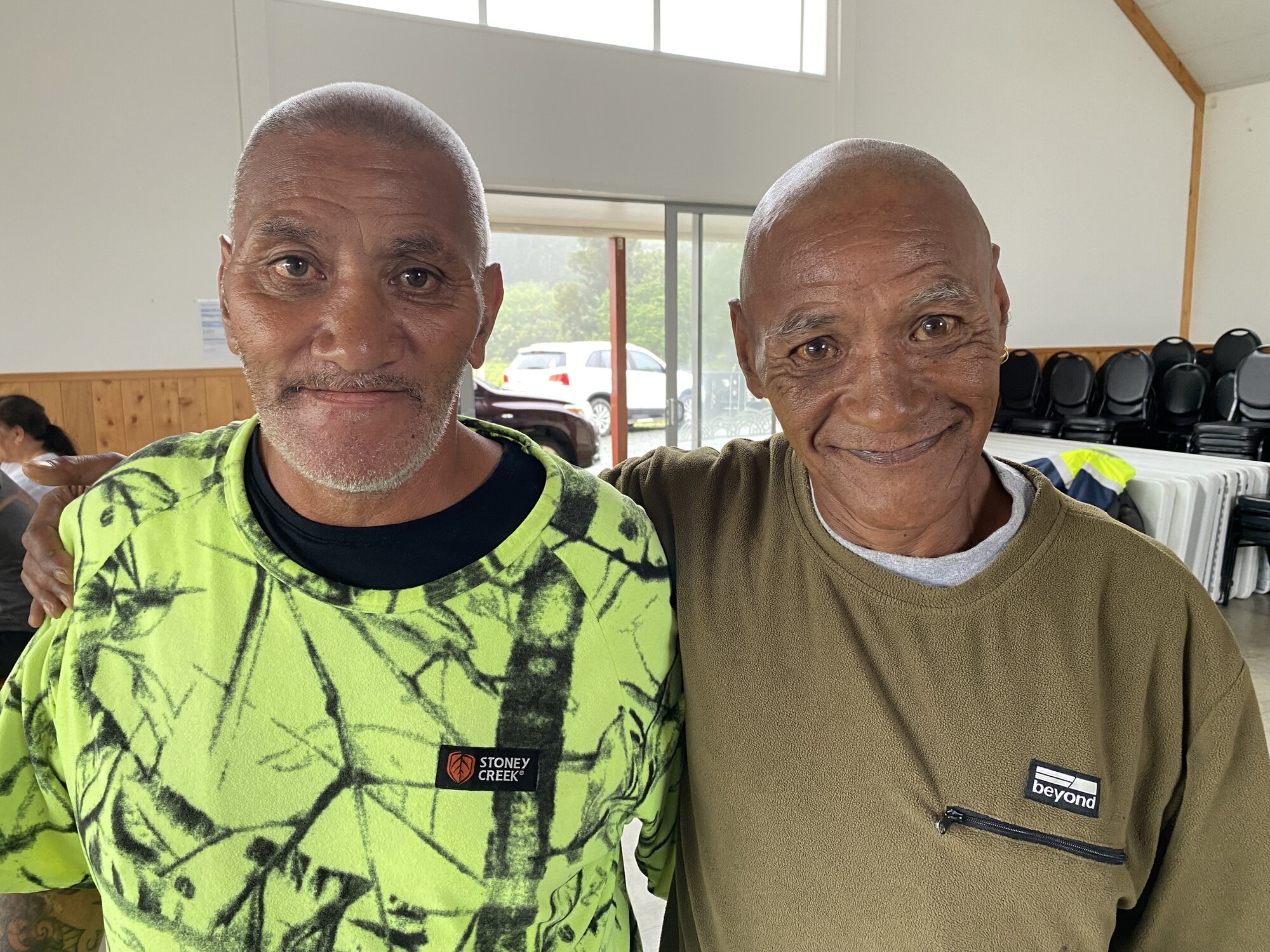 Brothers Pattinson Wetere (left) and Simon Simeon both escaped with their lives from raging floodwaters and are taking refuge at the Mōkau Marae civil defence centre. Photo / Susan Botting