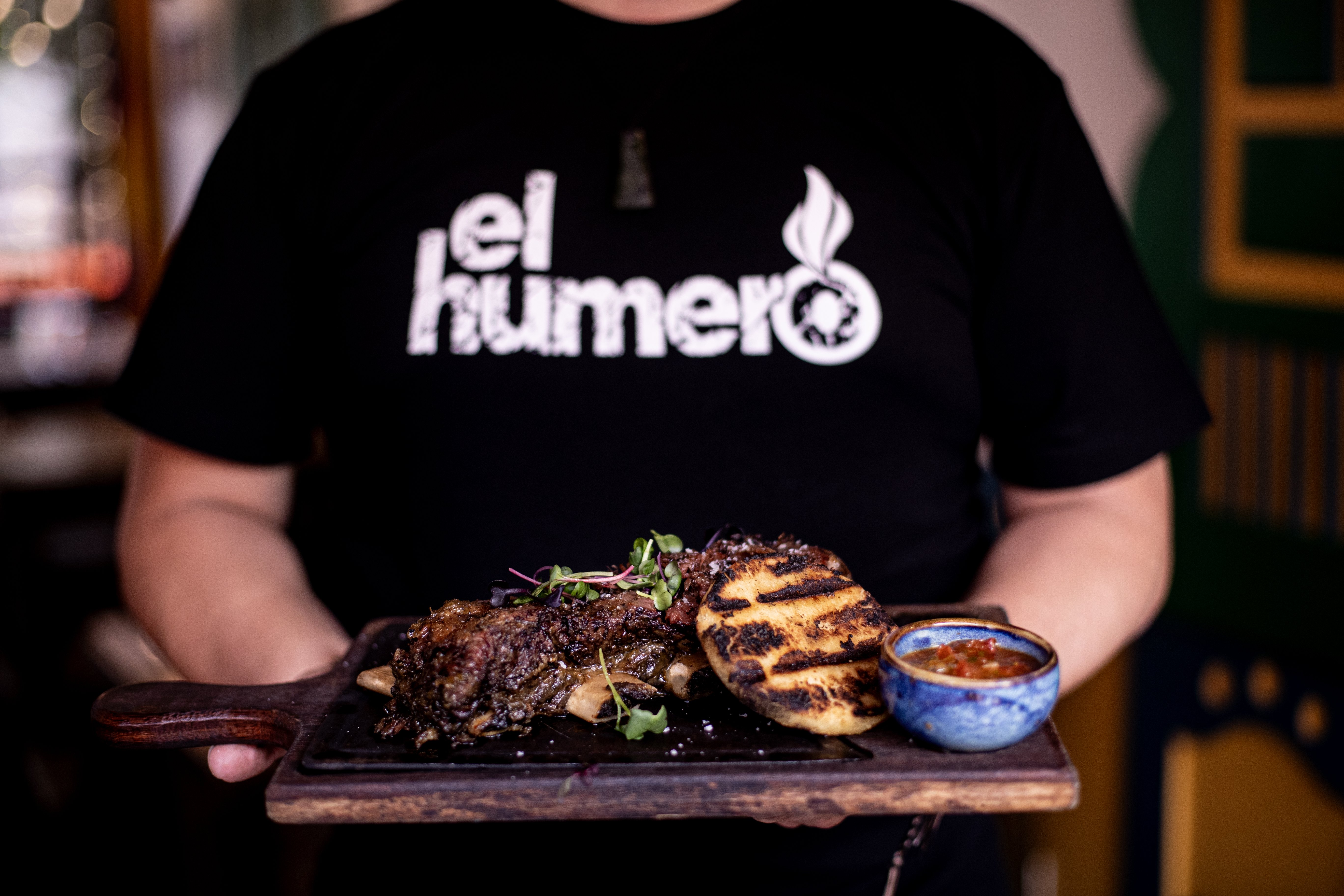 Short ribs with cassava wedges and salsa criolla. Photo / Dean Purcell