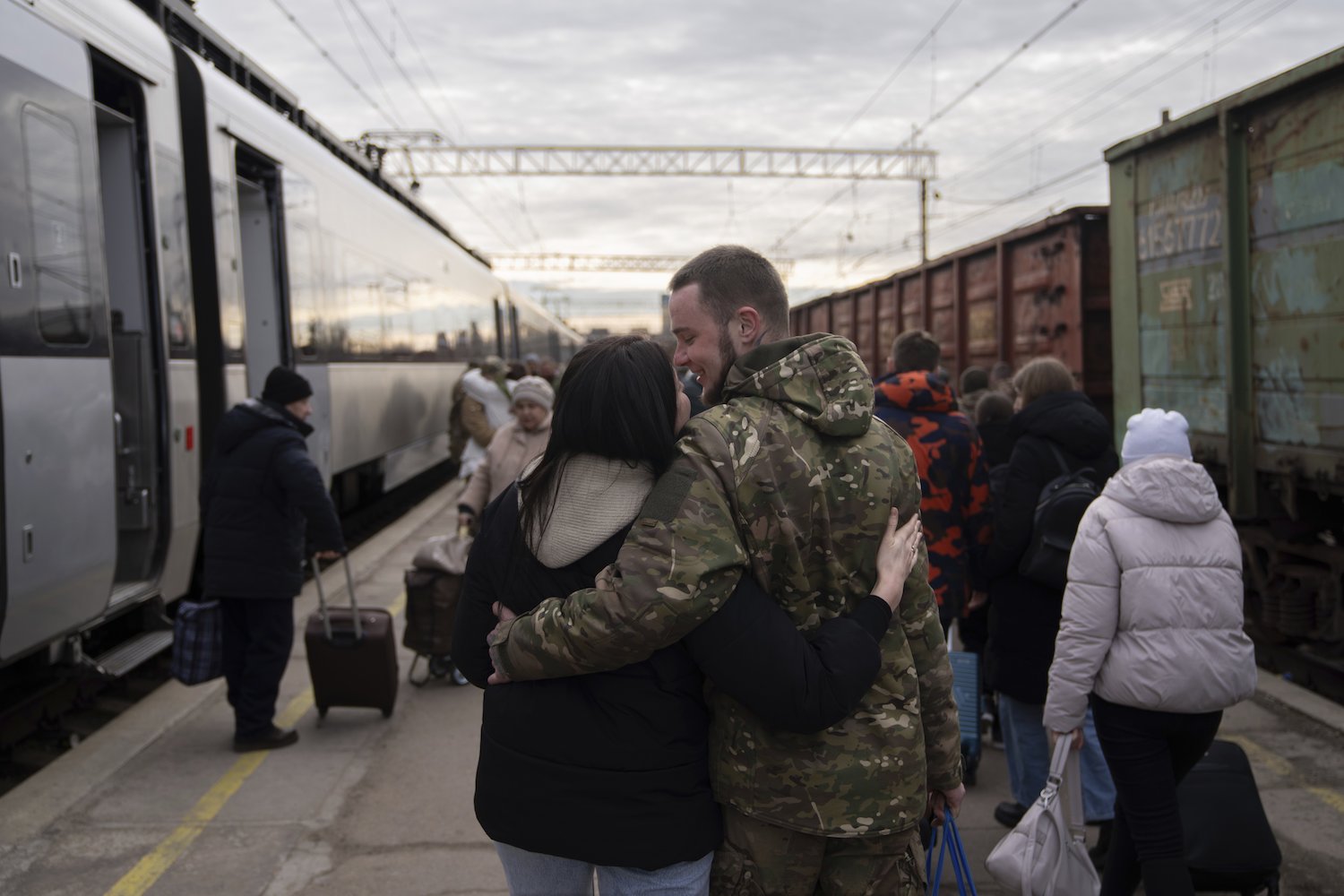 Ukrainian serviceman Roman (right) hugs his wife Ludmila at the railway station in Kramatorsk, Donetsk region, Ukraine. Photo / AP