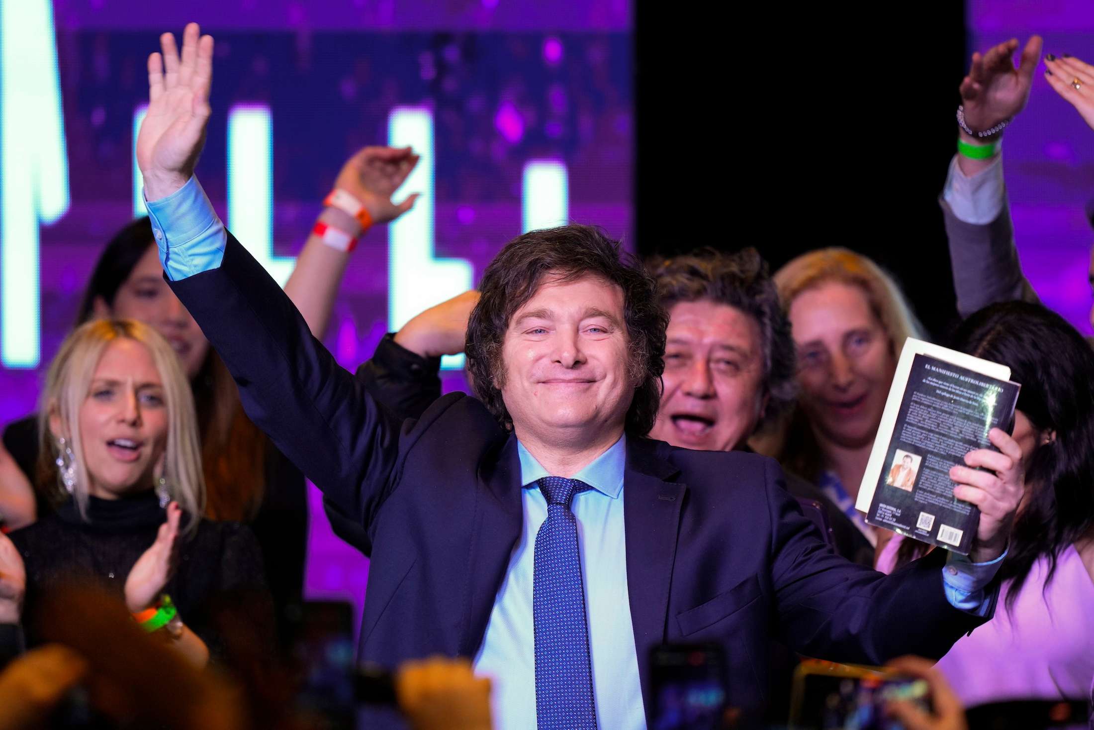 Javier Milei, presidential candidate of the Liberty Advances coalition, waves at his campaign headquarters after polls closed for general elections in Buenos Aires. Photo / AP