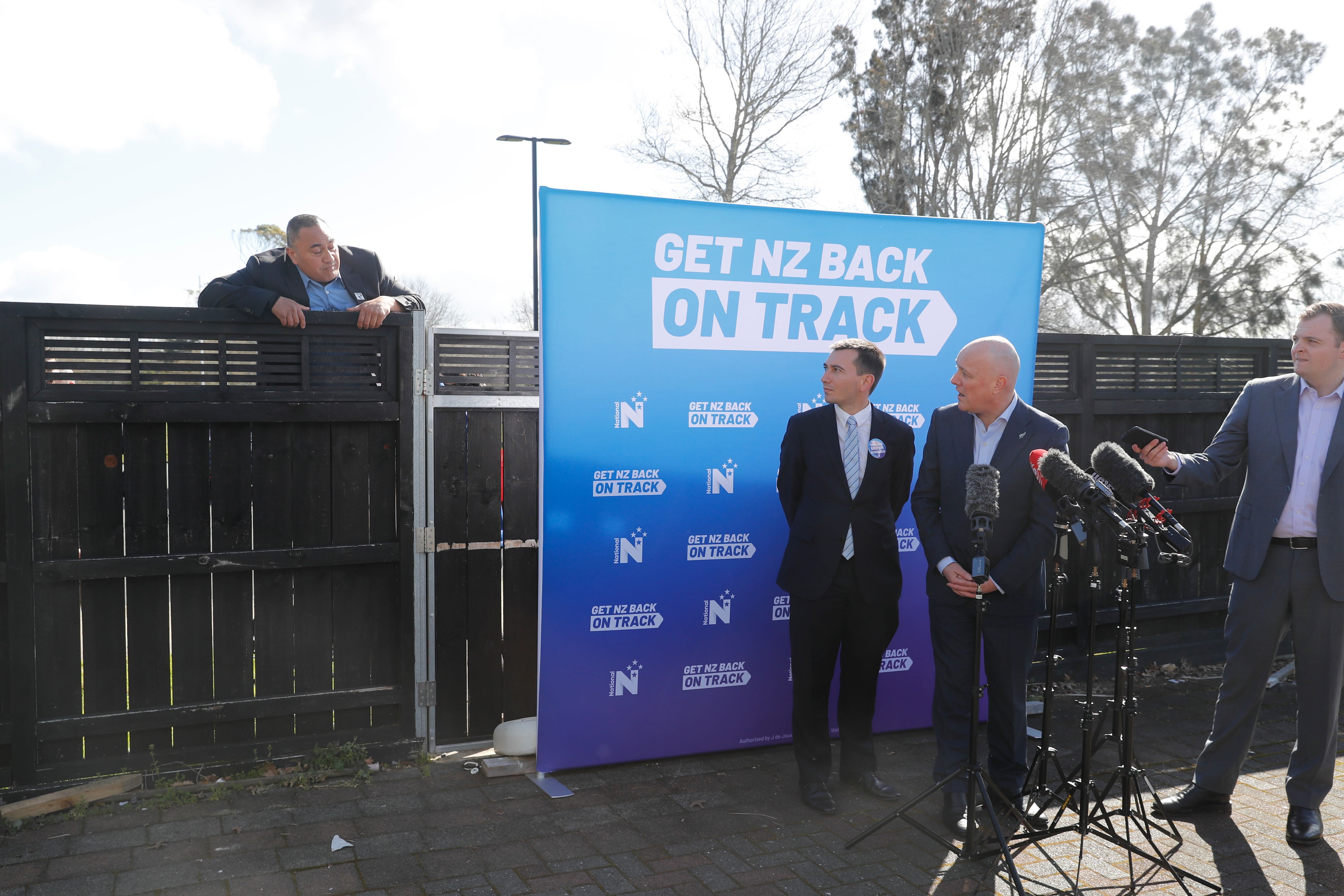 Serial heckler Karl Mokaraka, left, interrupts Christopher Luxon during a campaign event last year. Photo / Dean Purcell