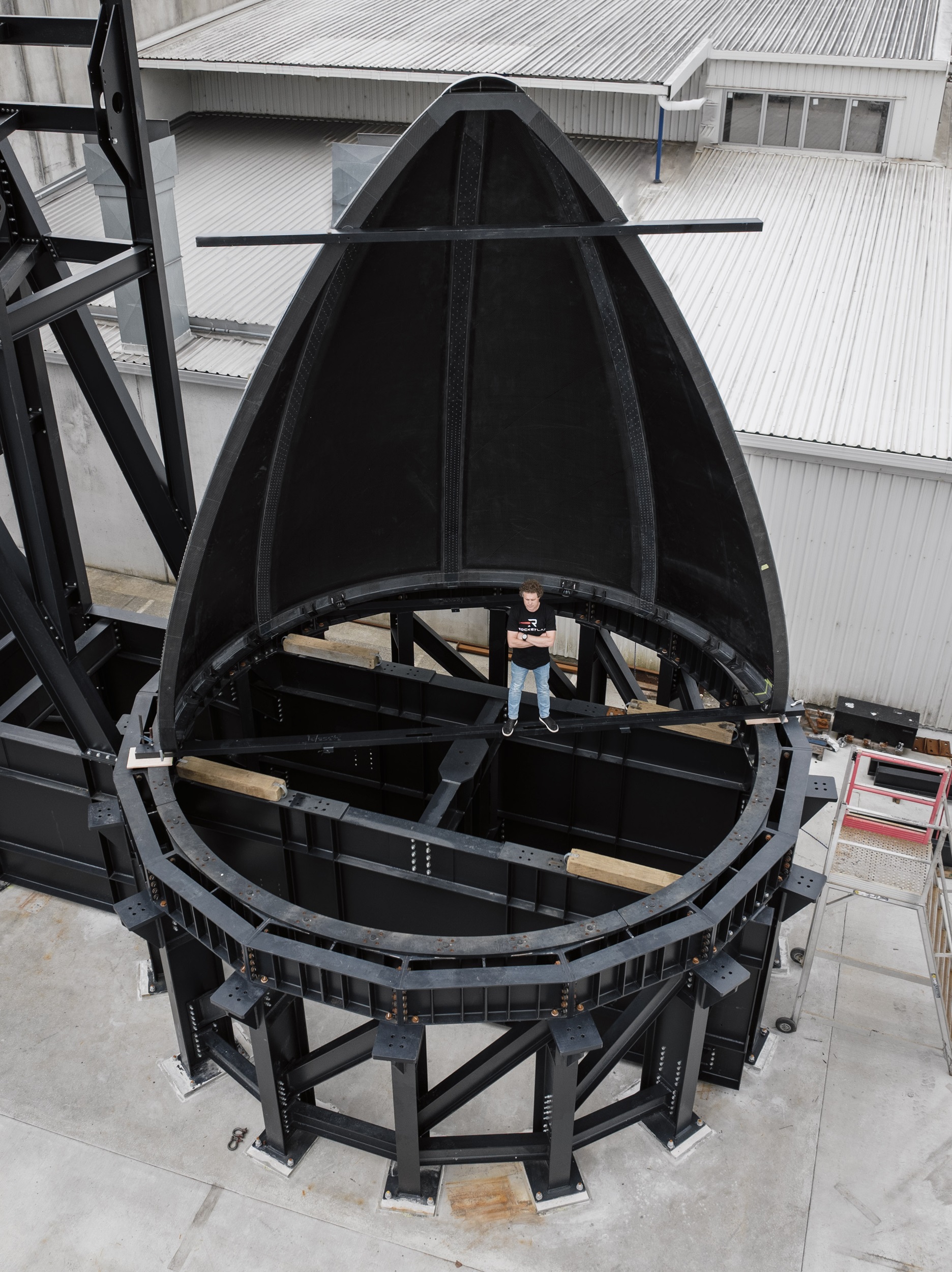 Rocket Lab founder and chief executive Sir Peter Beck stands inside the fairing (nose cone) of his company's Neutron rocket, due for its maiden launch by year's end. 
