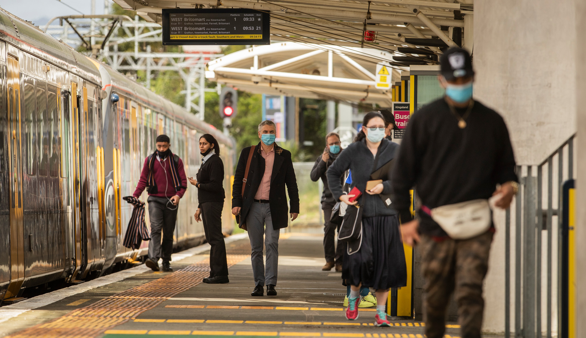 Auckland commuters at the Kingsland Train Station. Masks will become mandatory on Auckland transit and domestic flights next week. Photo / Greg Bowker