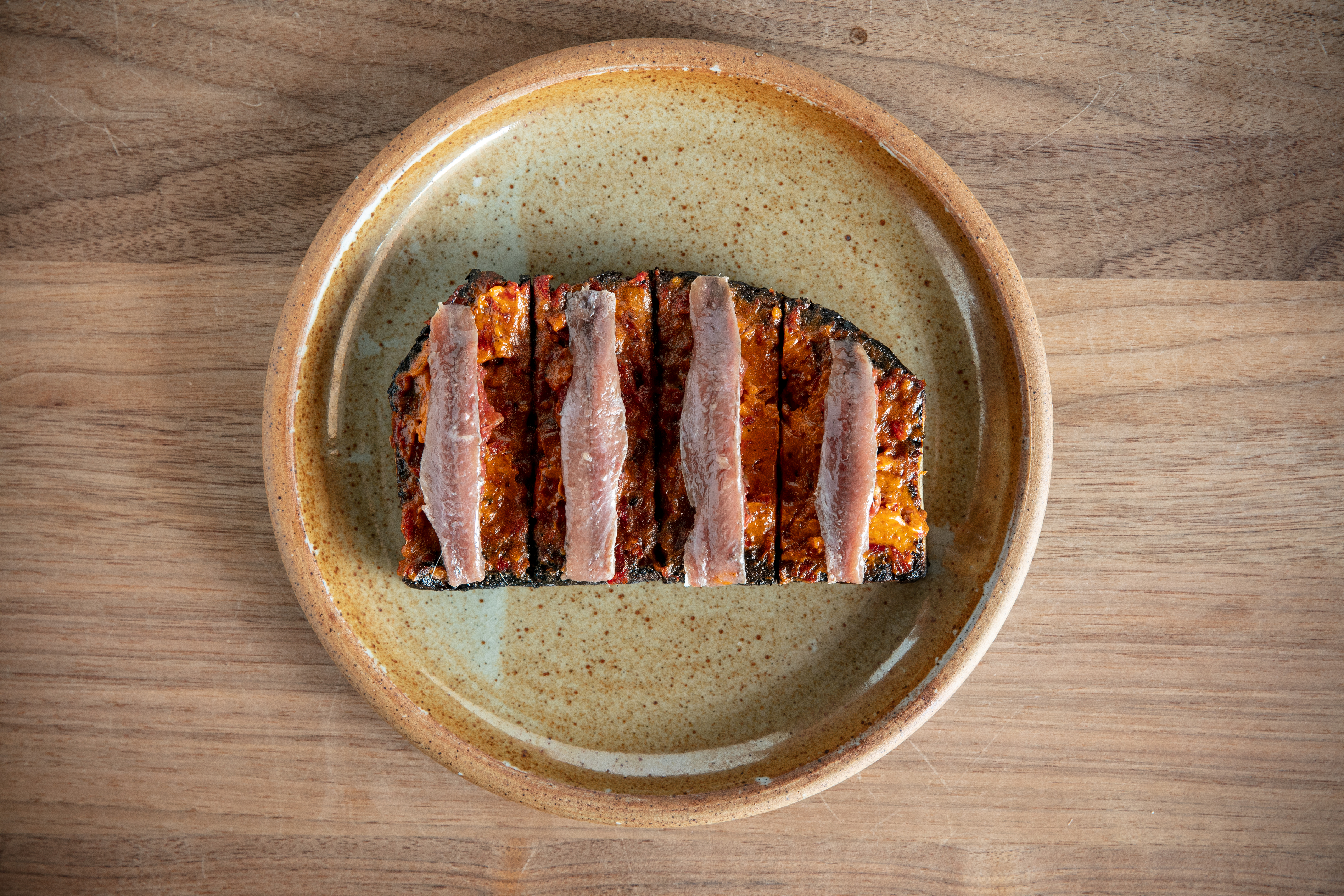 The anchovy and tomato tostada. Photo / Babiche Martens