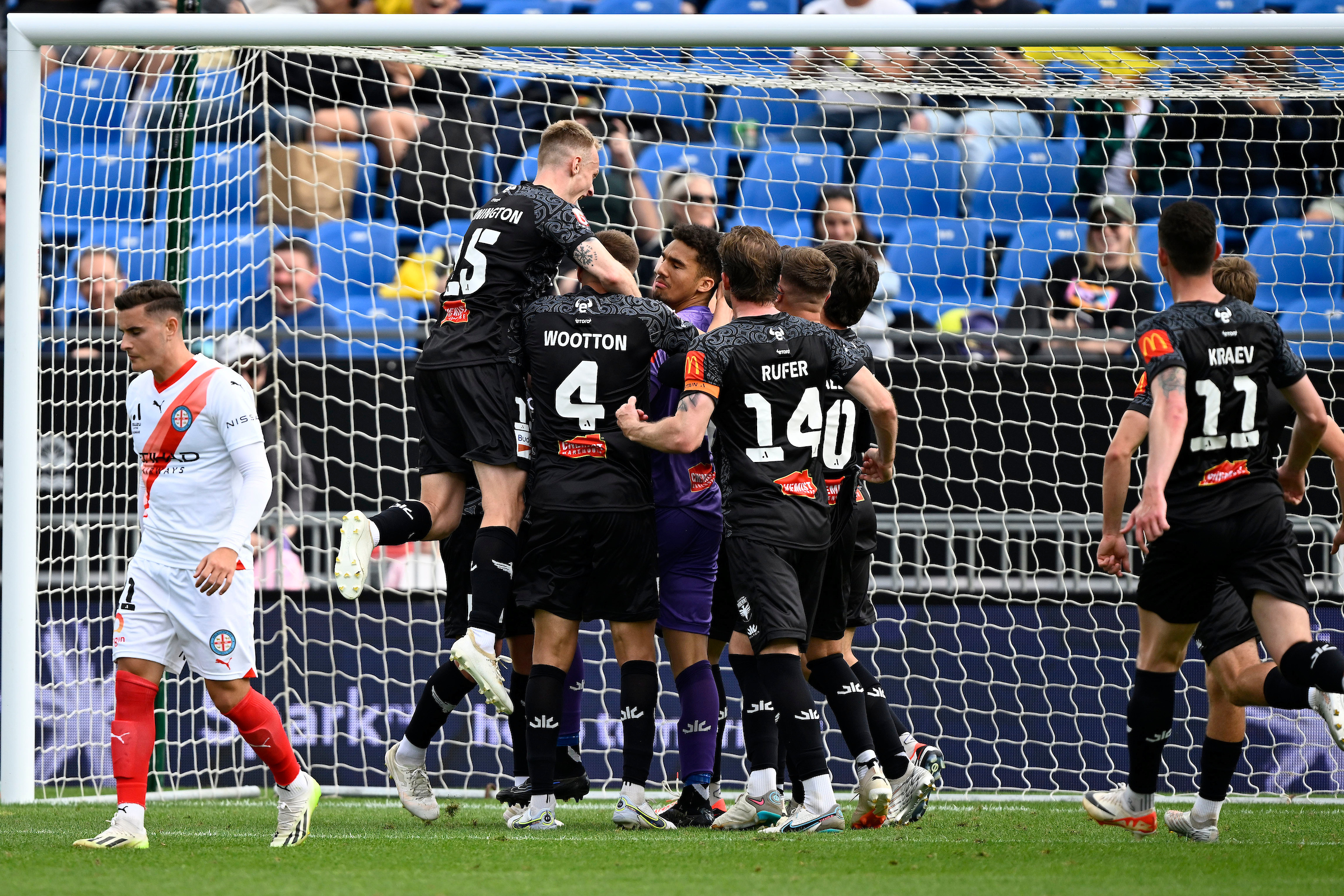 The Phoenix celebrate Alex Paulsen's spot-kick save. Photo / Photosport