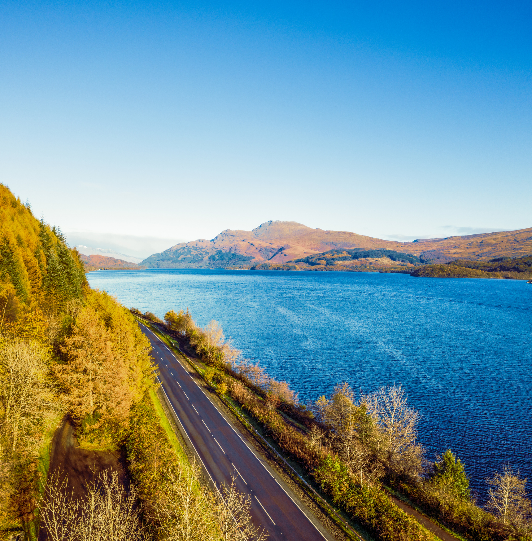 A great way to see more of Loch Lomond in Central Scotland - and get off the roads - is to cycle the West Loch Lomond Cycle Path. Photo / Getty Images
