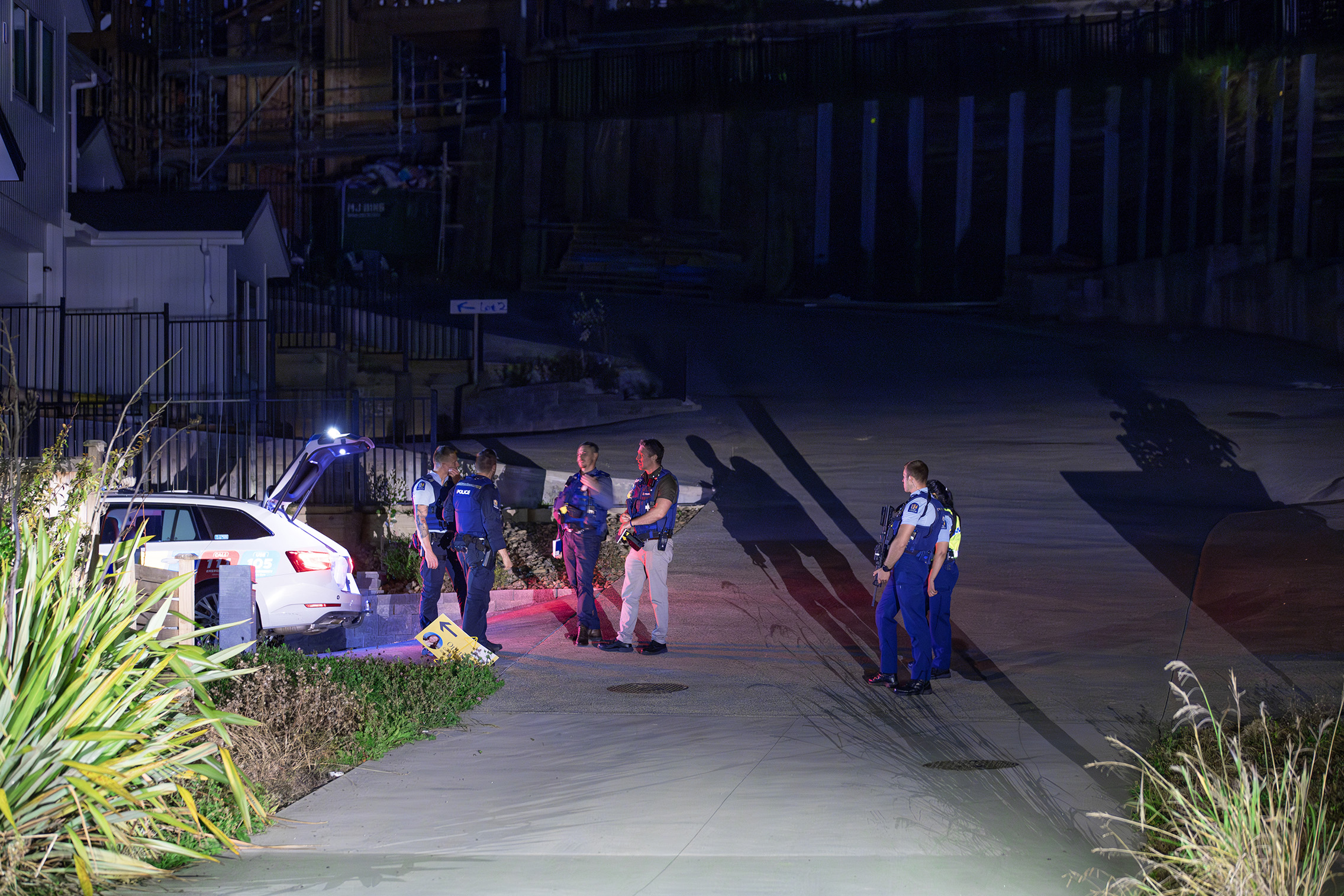 Police staff at an address on Mackay Dr, Greenhithe after a woman was found nearby with serious injuries. Photo / Hayden Woodward