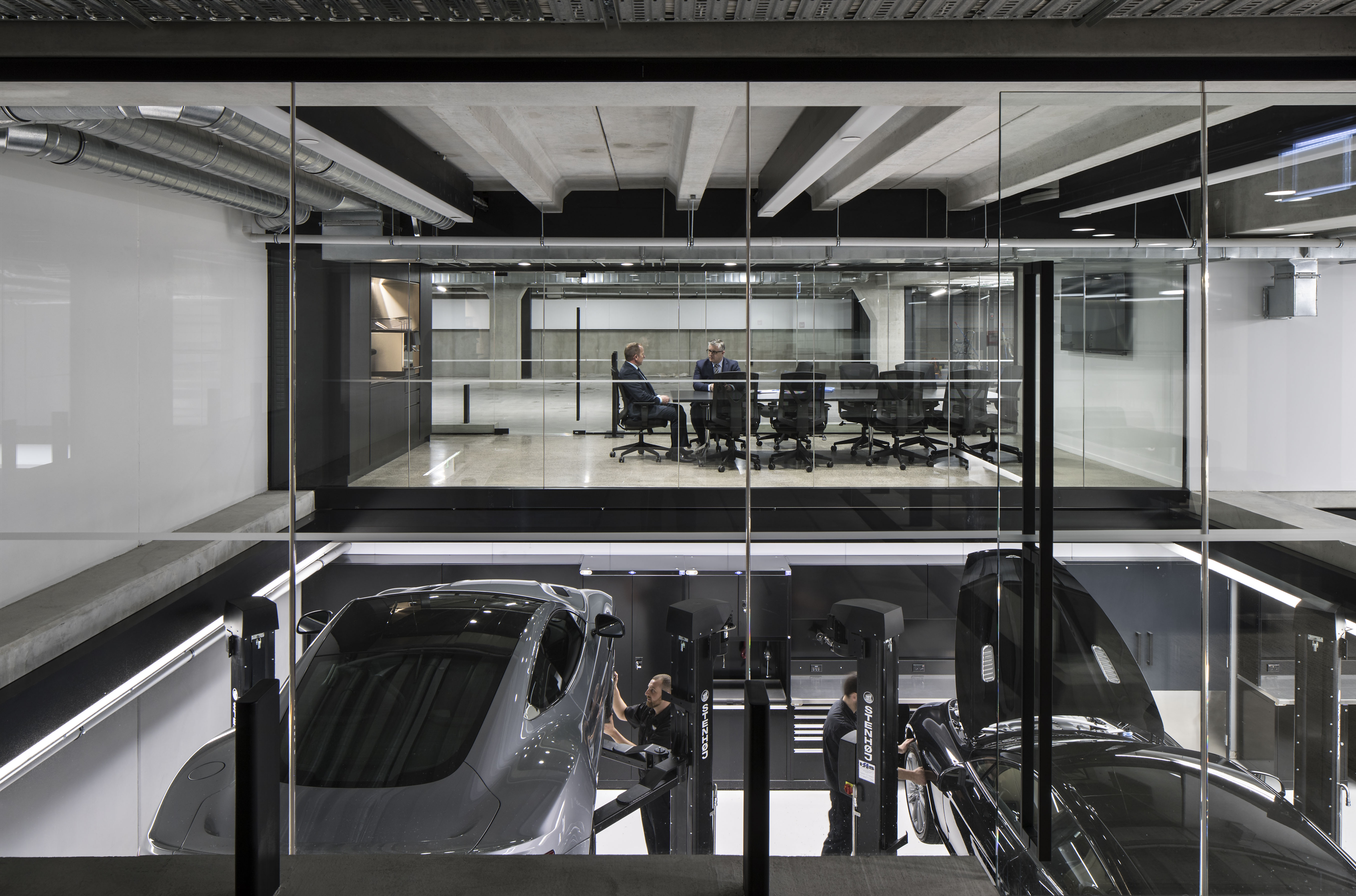 Technicians at work below a meeting room.