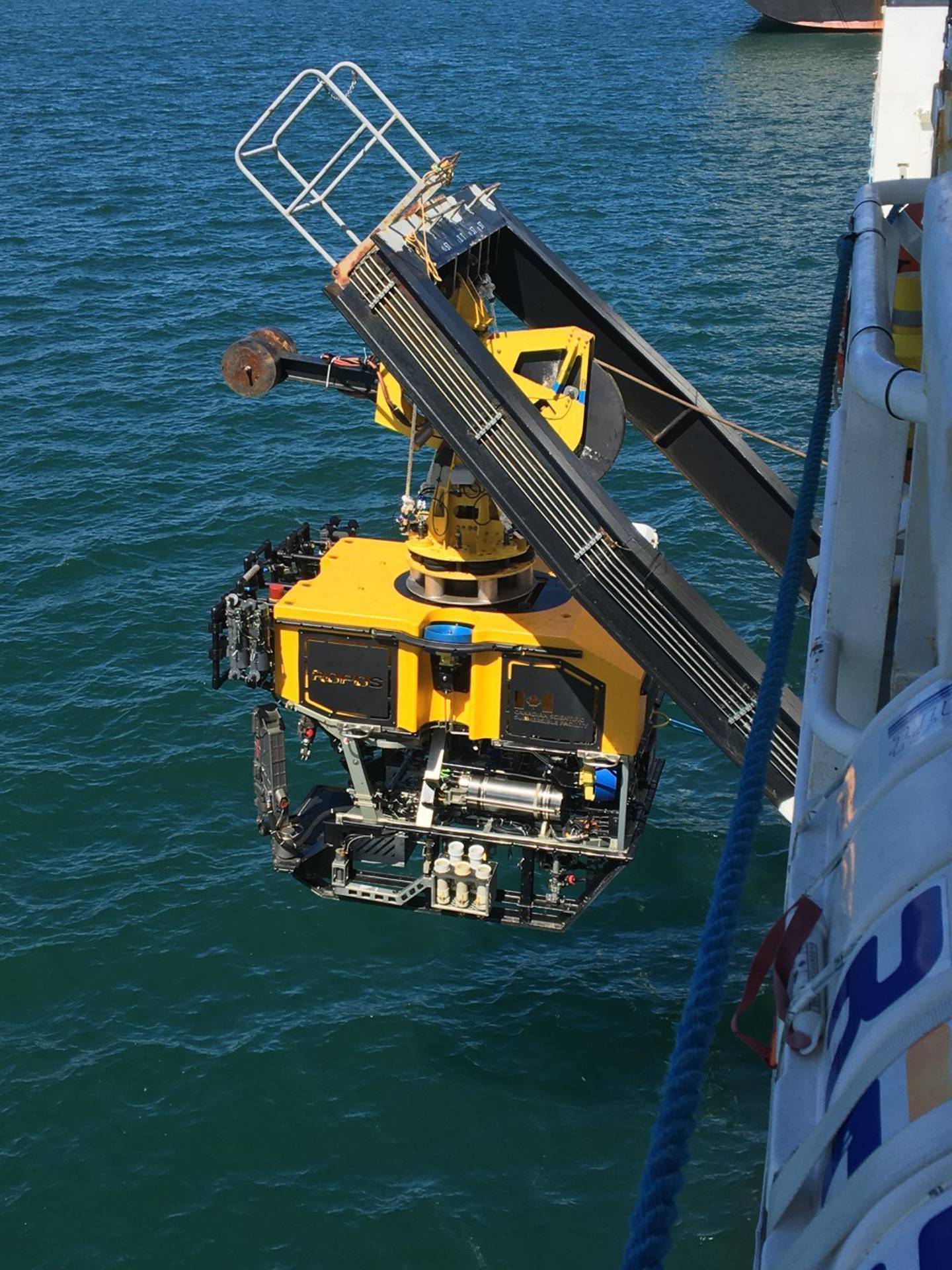 An underwater remotely operated vehicle, pictured being lowered from the RV Tangaroa, is helping a team of scientists understand the Hikurangi Subduction Zone earthquakes. Photo / Laura Wallace