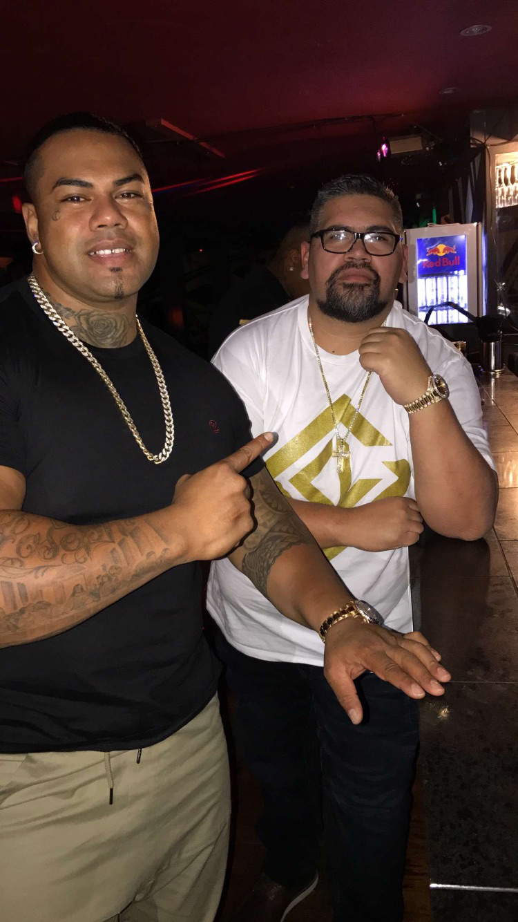 Nate Nauer socialising with Pasilika Naufahu (left), the president of the New Zealand chapter of the Comancheros gang.