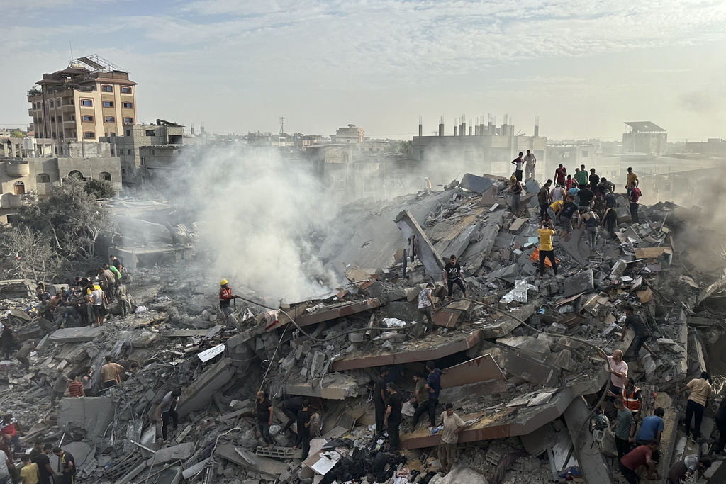 Palestinians look for survivors following Israeli airstrike in Nusseirat refugee camp, Gaza Strip on October 31. Photo / AP