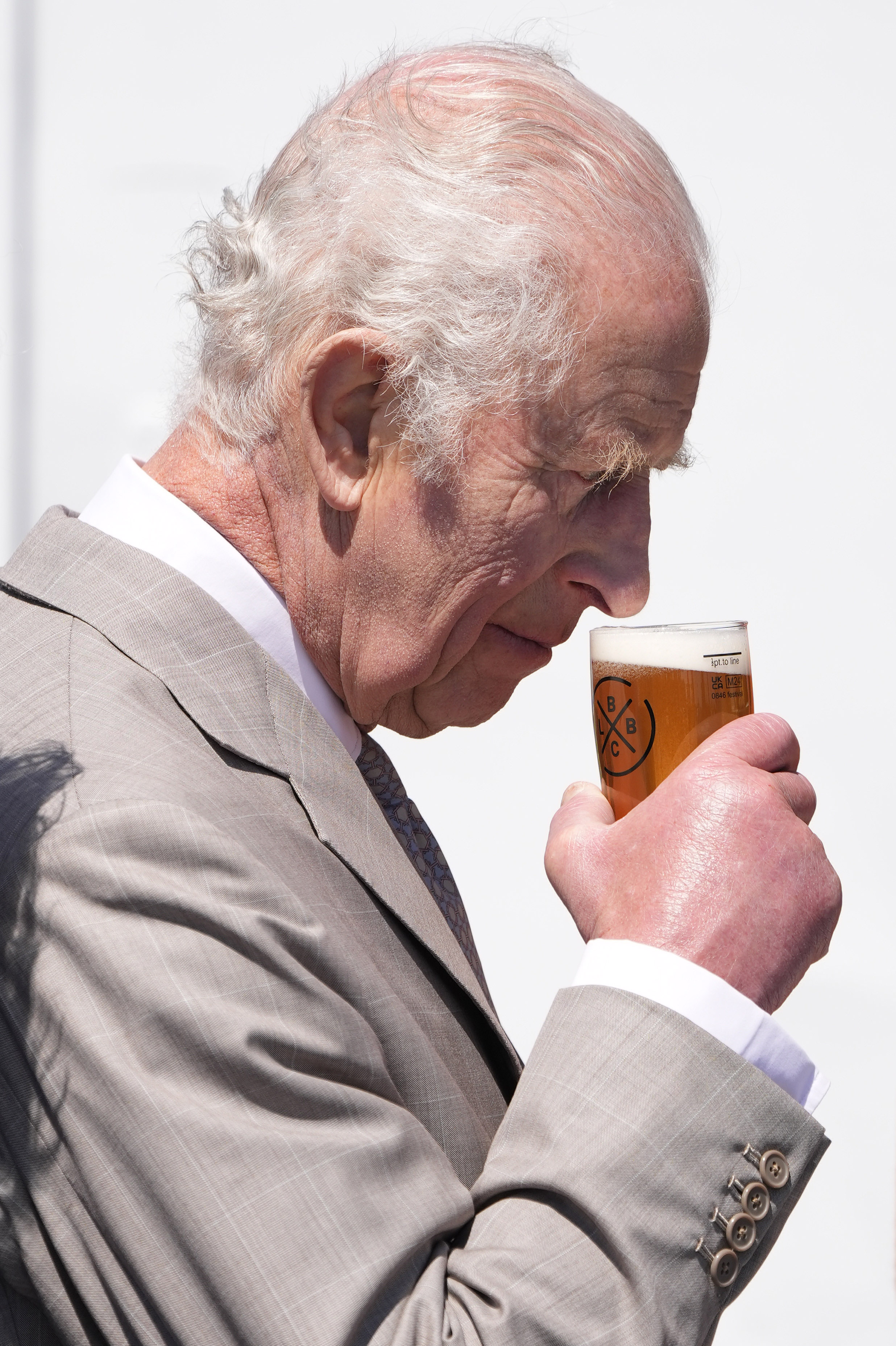 King Charles tries the new Guernsey ale that was brewed and named in his honour. Photo / Getty Images