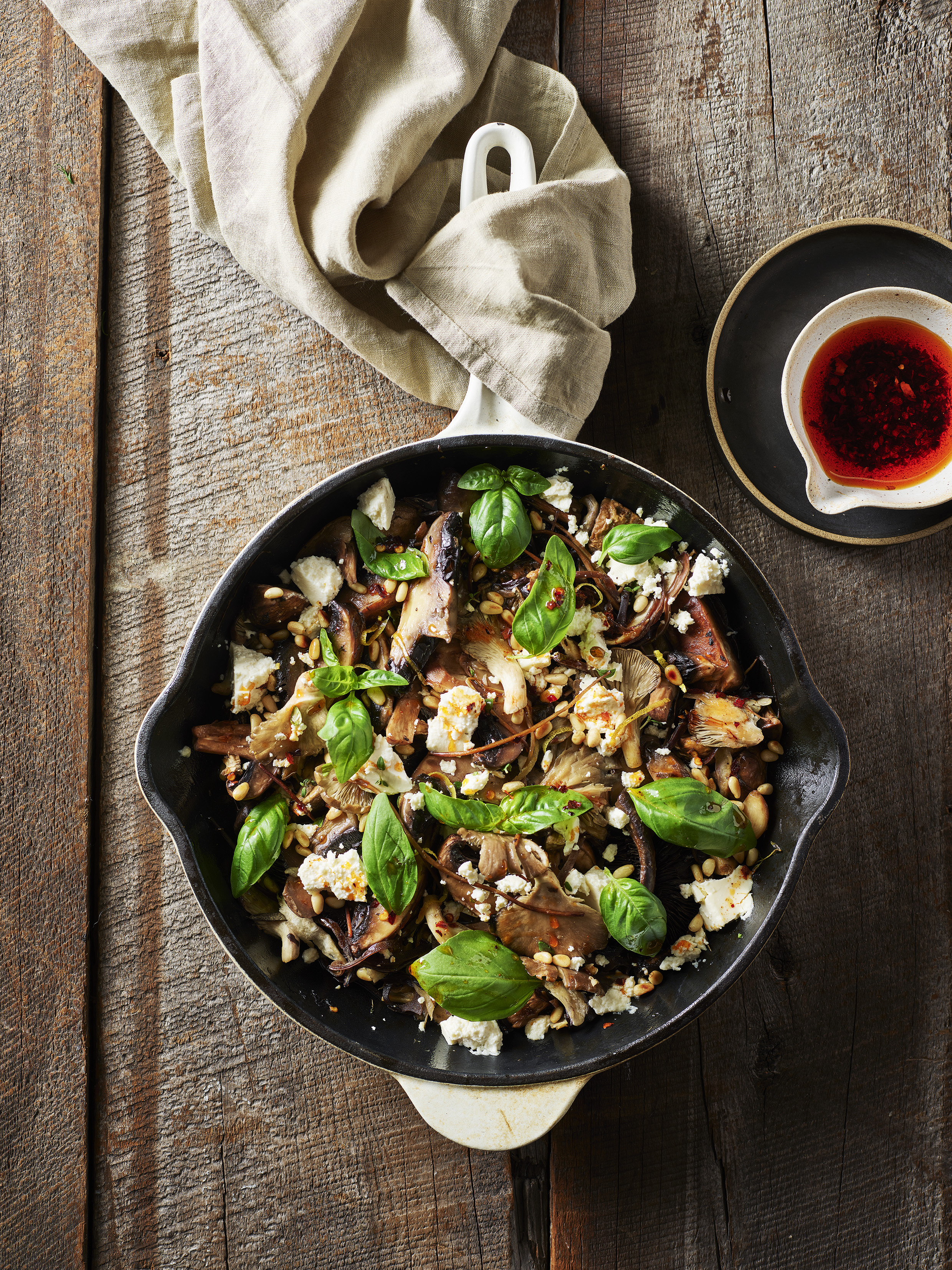 Herby skillet mushrooms with lemon, feta and pine nuts. Photo / Melanie Jenkins (Flash Studios)