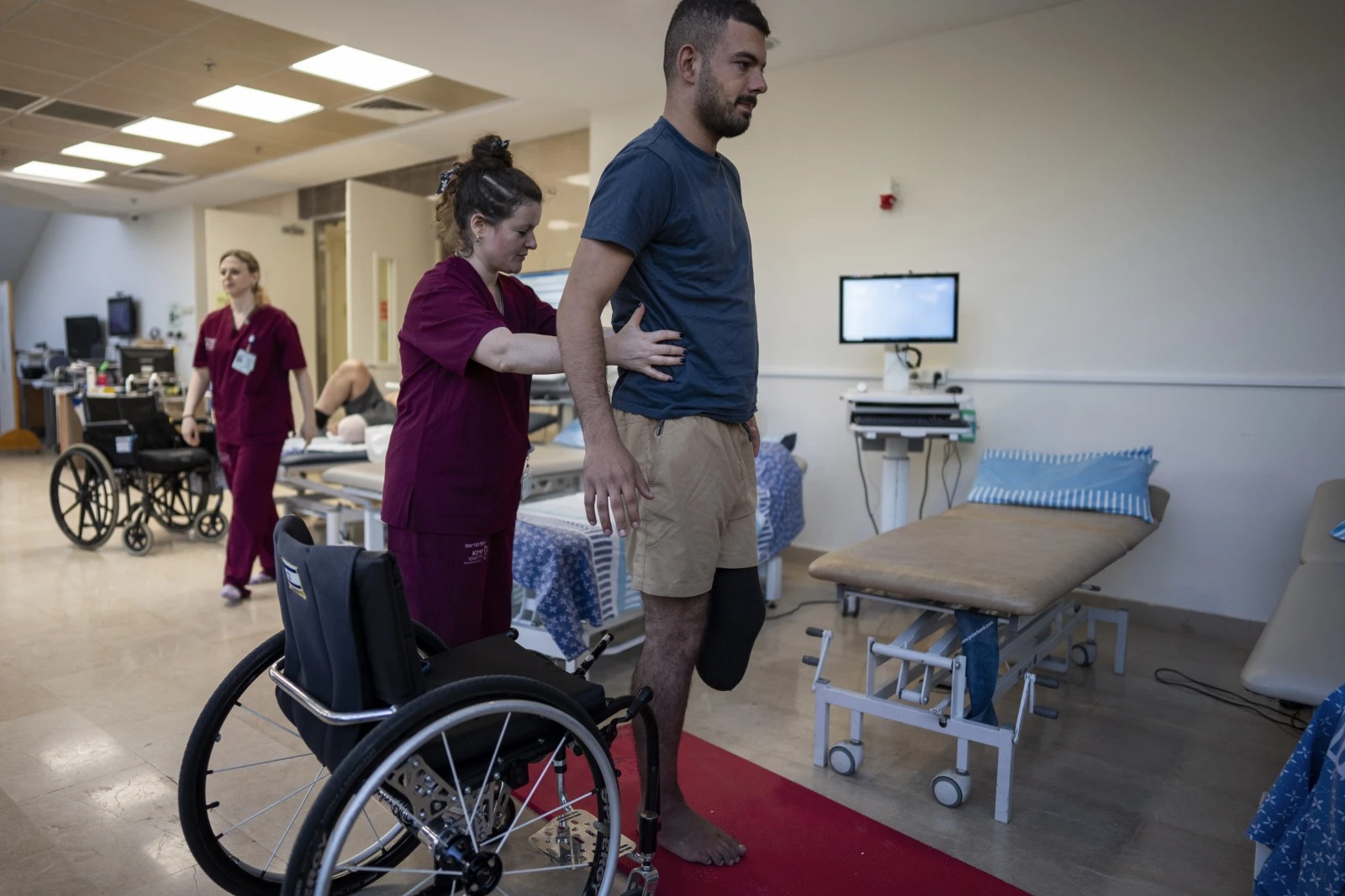 Israeli soldier Jonathan Ben Hamou, 22, wounded in the war with Hamas, practises standing during a physiotherapy session in Sheba Hospital’s rehabilitation division in Ramat Gan, Israel. Photo / AP