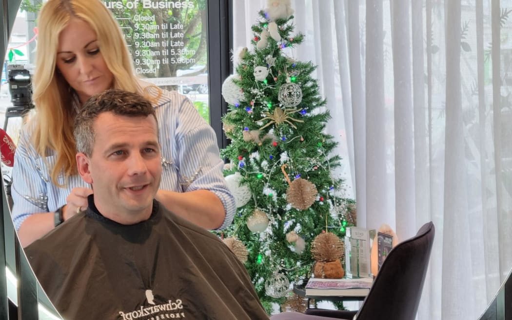 David Seymour gets a trim after announcing a review of hairdressing regulations. 