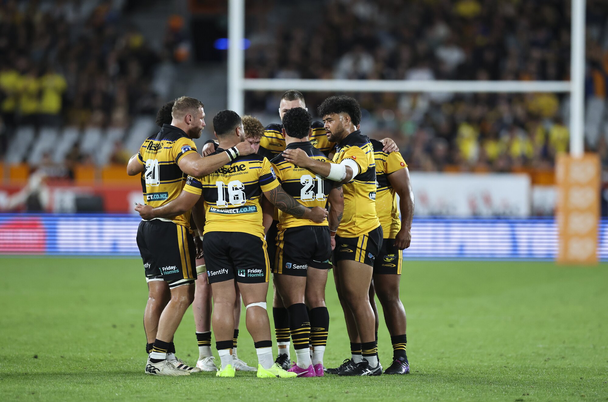 Hurricanes players share their thoughts during the Super Rugby clash against the Highlanders. Photo / SmartFrame