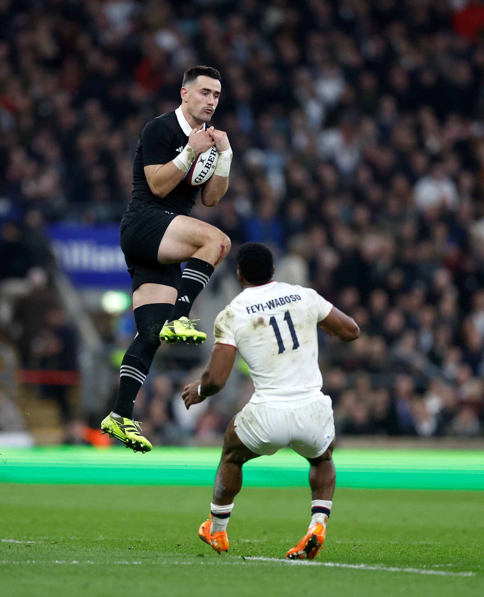 All Blacks fullback Will Jordan catches the high ball ahead of England's Immanuel Feyi-Waboso. Photo / Photosport