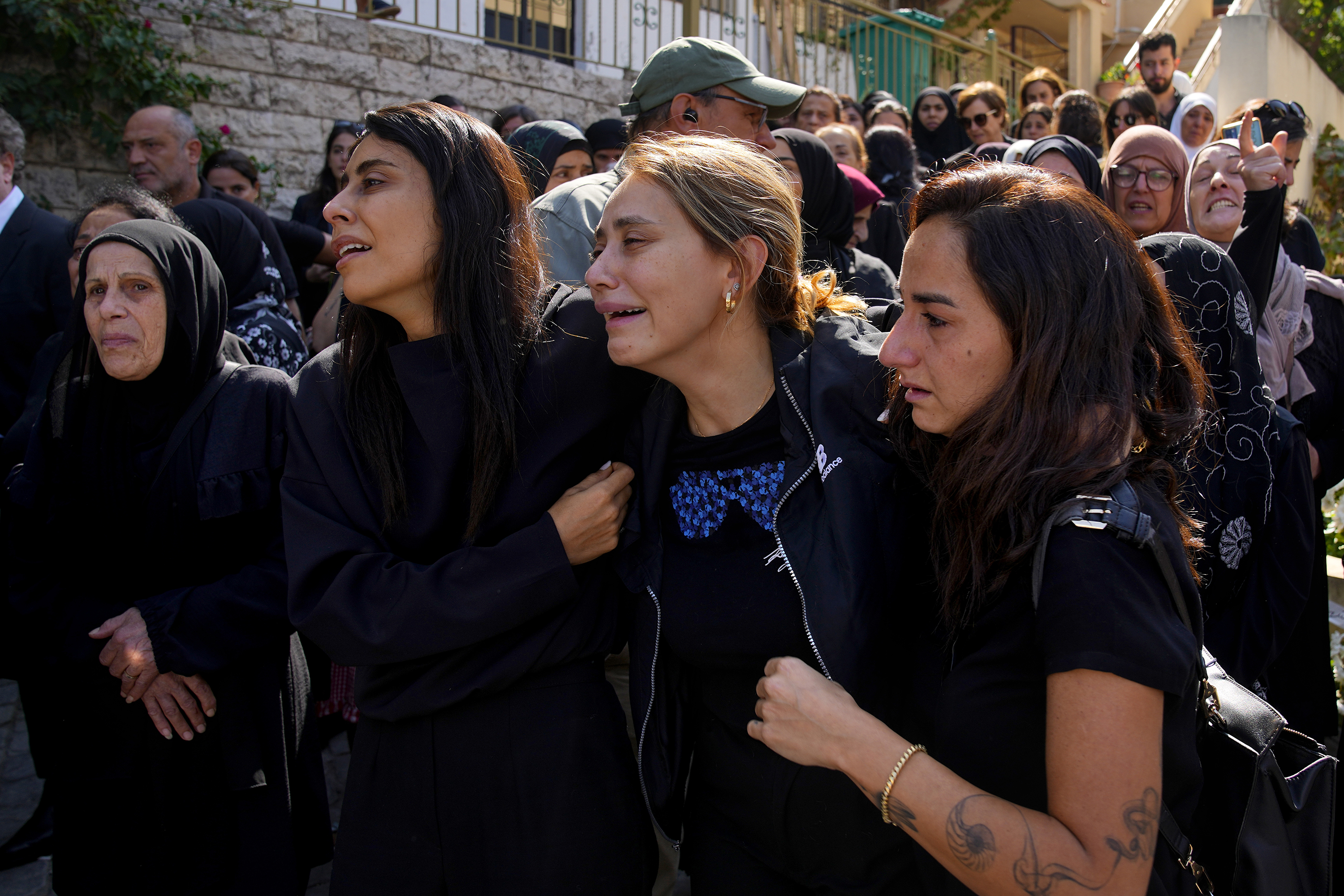Relatives of Issam Abdallah mourn during his funeral procession. Photo / AP