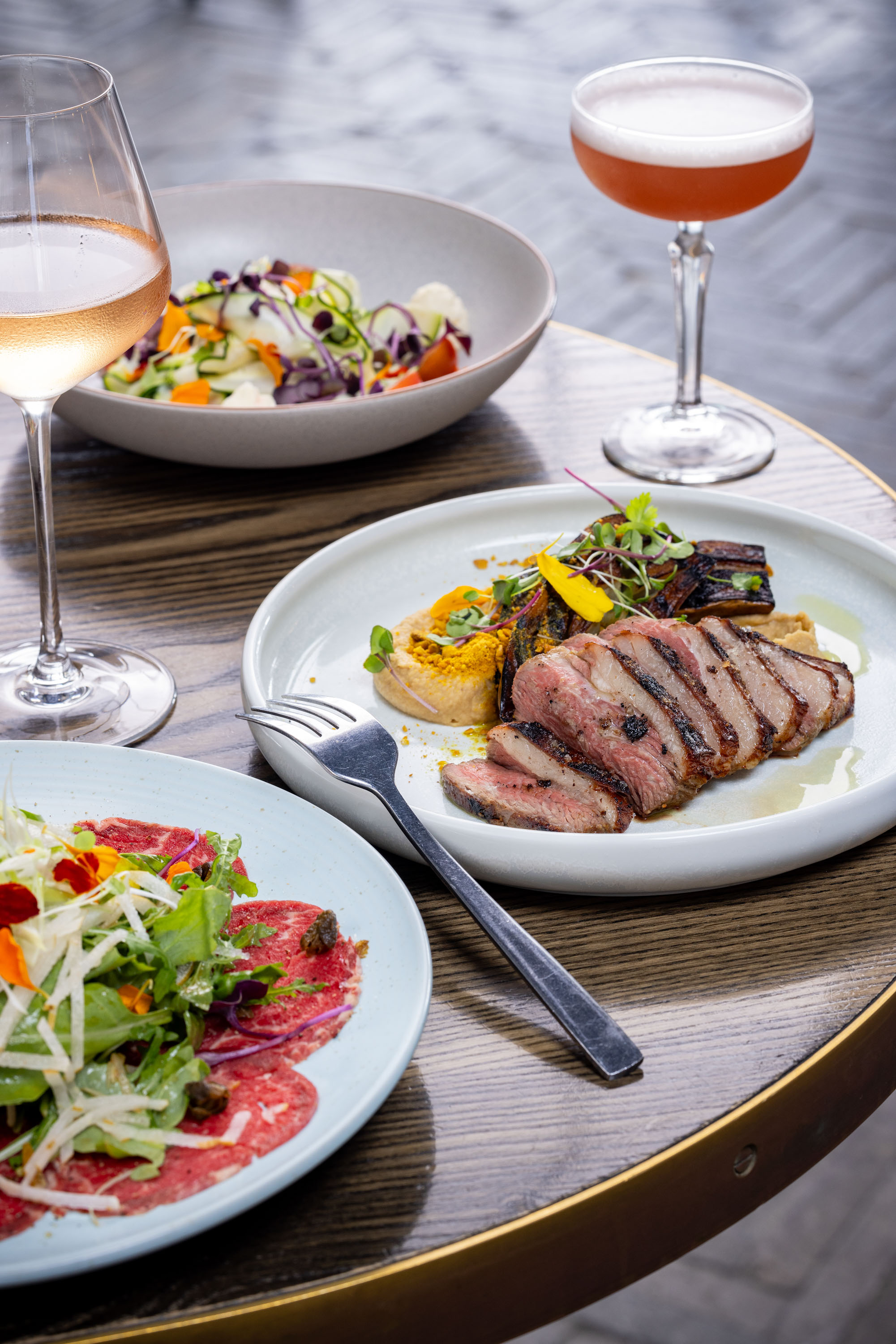 The beef carpaccio, the lamb and the courgette salad on the menu at Mr Pickles in Hamilton. Photo / Babiche Martens