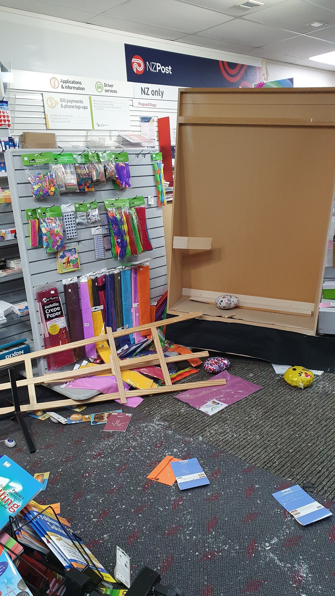 Stationary items, post cards and art supplies were among products left sprewn about the store's floor after the burglary. Photo / Aboli Bhave