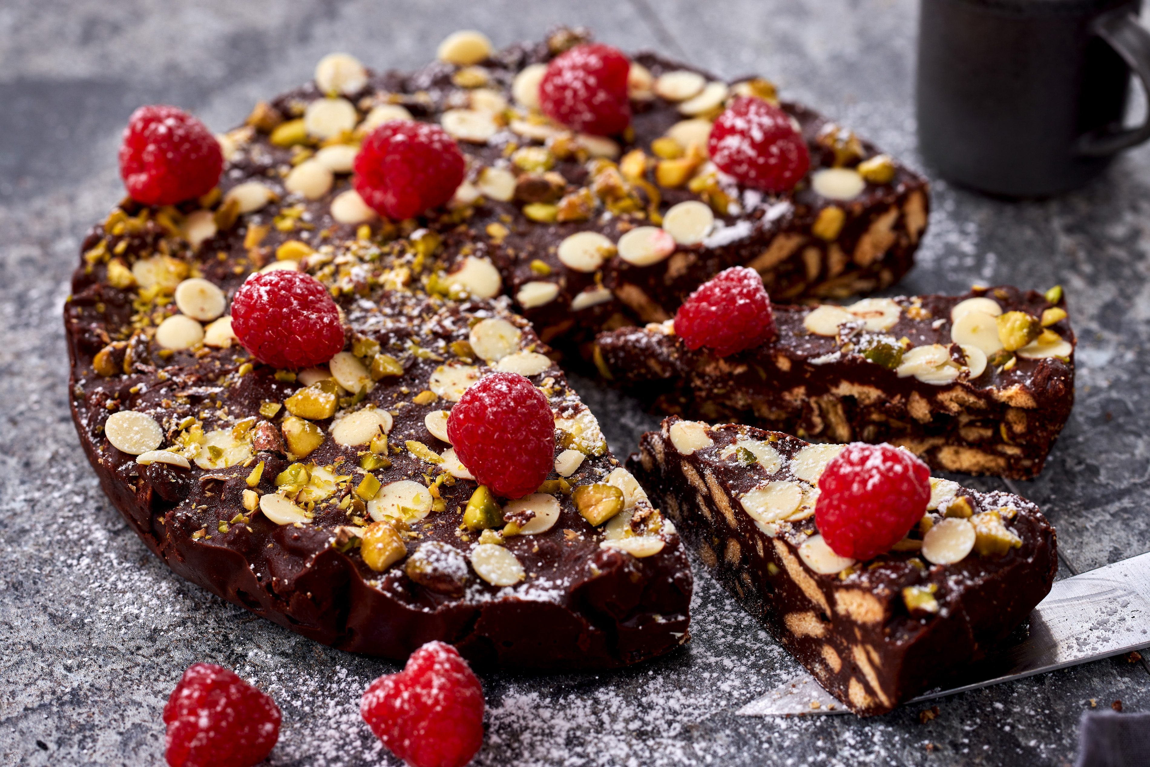This chocolate and pistachio slice is perfect to pack for a picnic. Photo / Babiche Martens