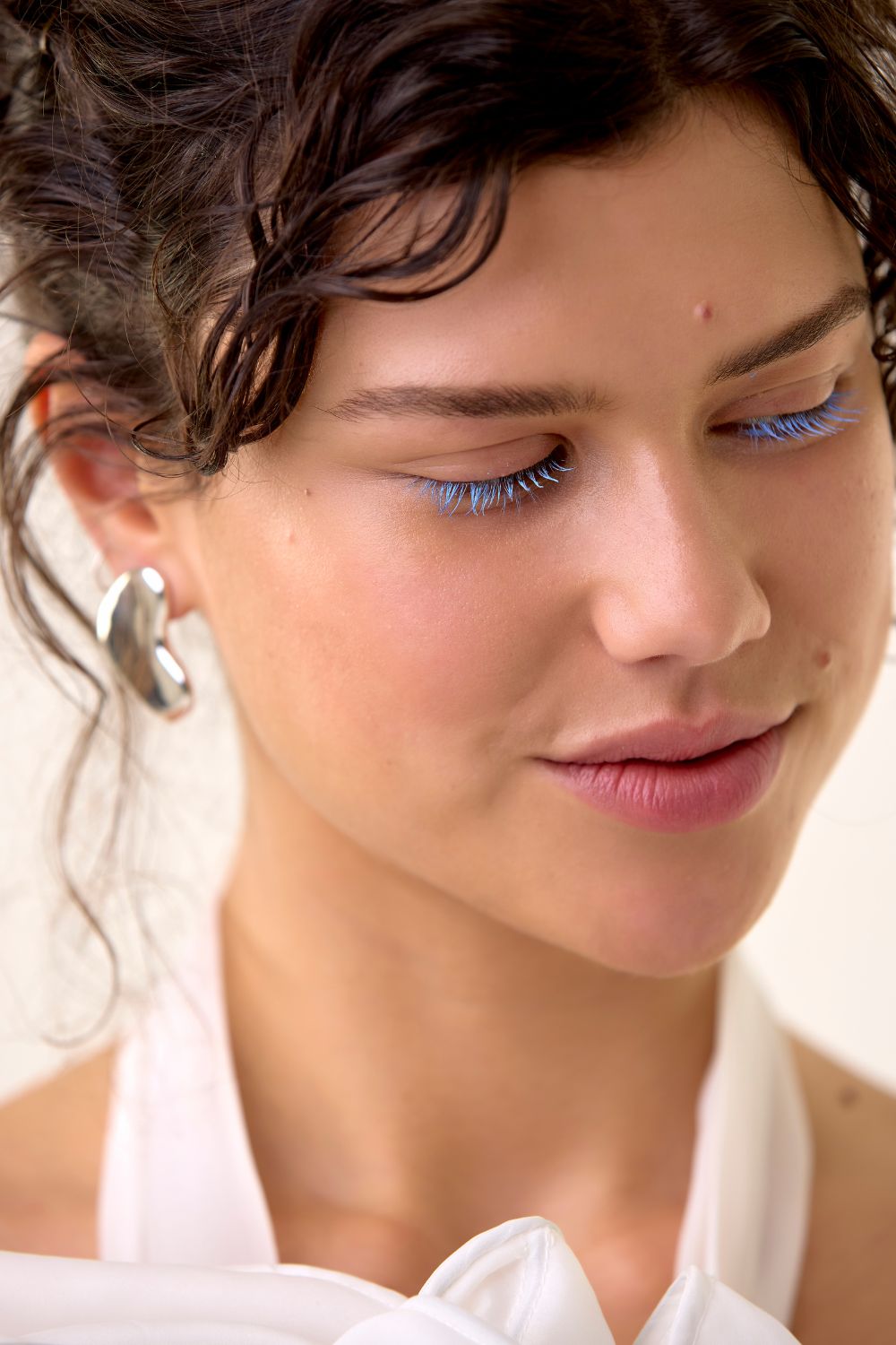 Hera Couture detachable bow POA. Meadowlark earrings $499. Photo / Babiche Martens