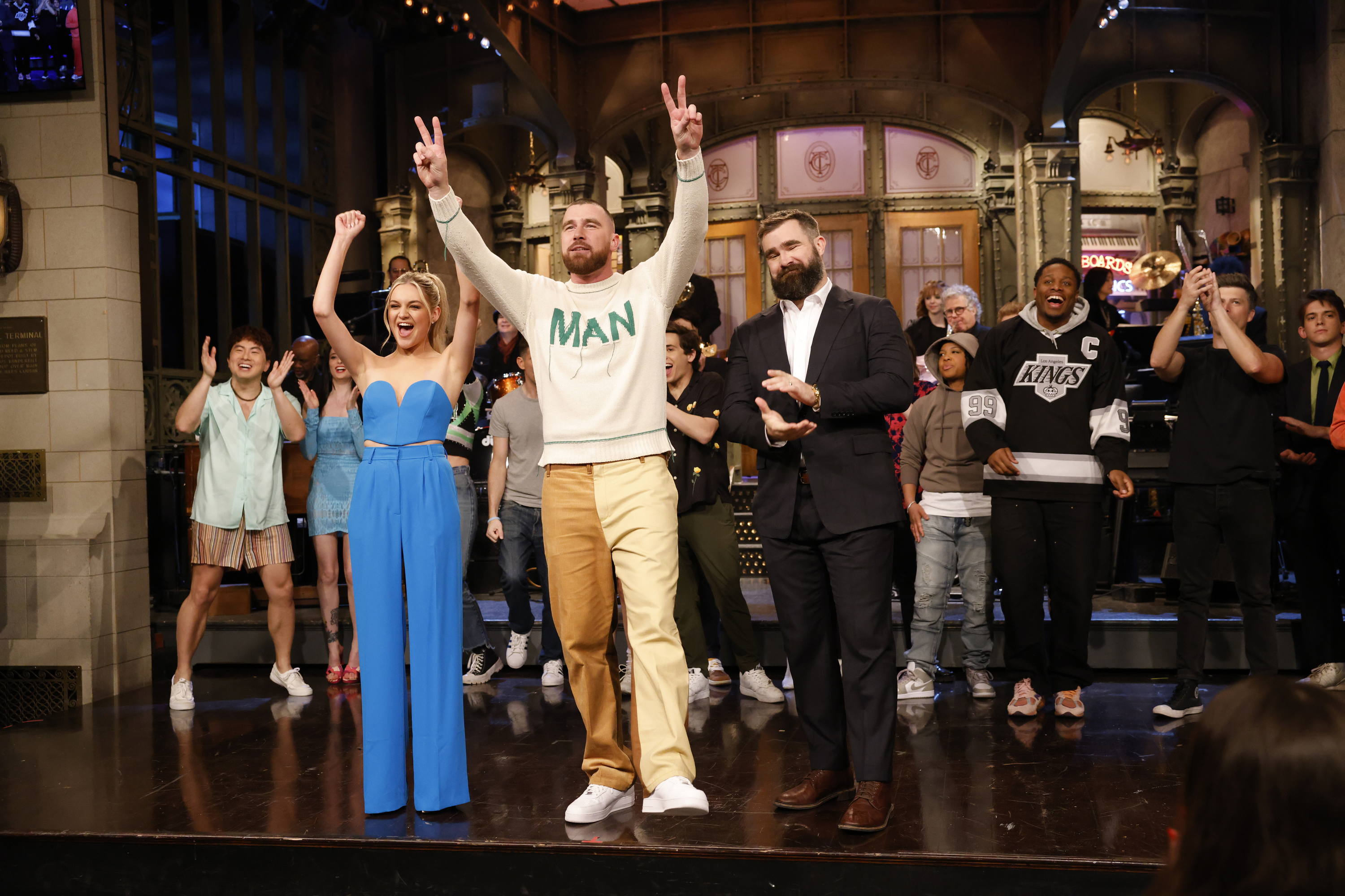 Musical guest Kelsea Ballerini, host Travis Kelce, and special guest Jason Kelce during the Goodnights & Credits on Saturday Night Live in March last year. Photo / Getty Images