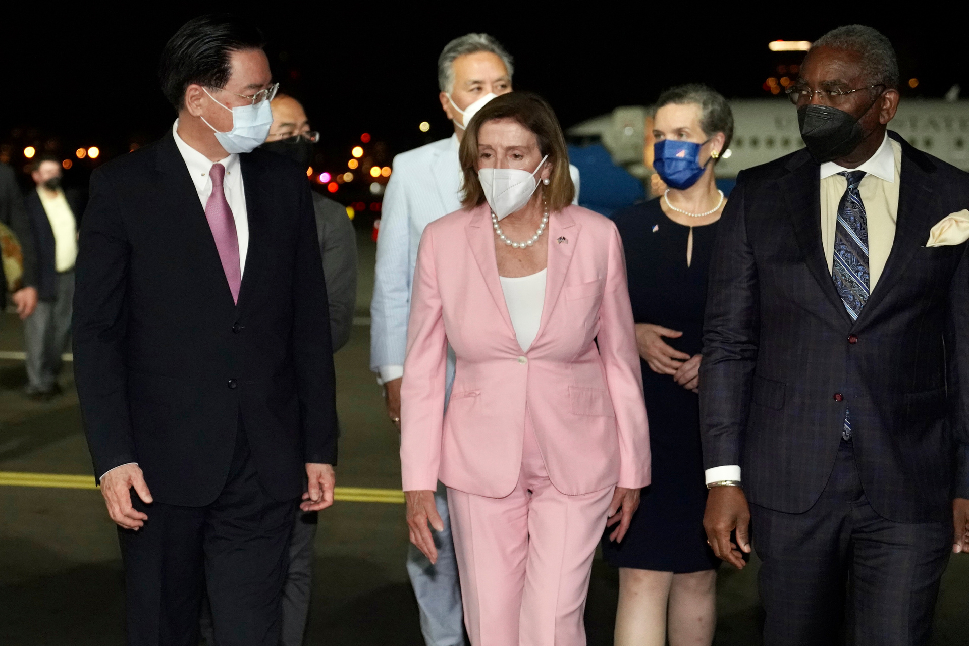 US House Speaker Nancy Pelosi, center, walks with Taiwan's Foreign Minister Joseph Wu, left, as she arrives in Taipei. Photo / Taiwan Ministry of Foreign Affairs via AP