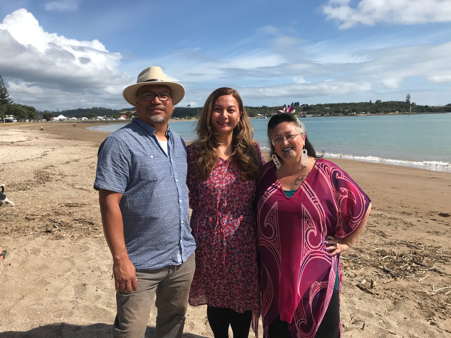 Green Party MPs Teanau Tuiono, co-leader Marama Davidson and Elizabeth Kerekere on the tātahi (beach) at Paihia, with the Waitangi Treaty grounds in the background. Photo / Michael Neilson
