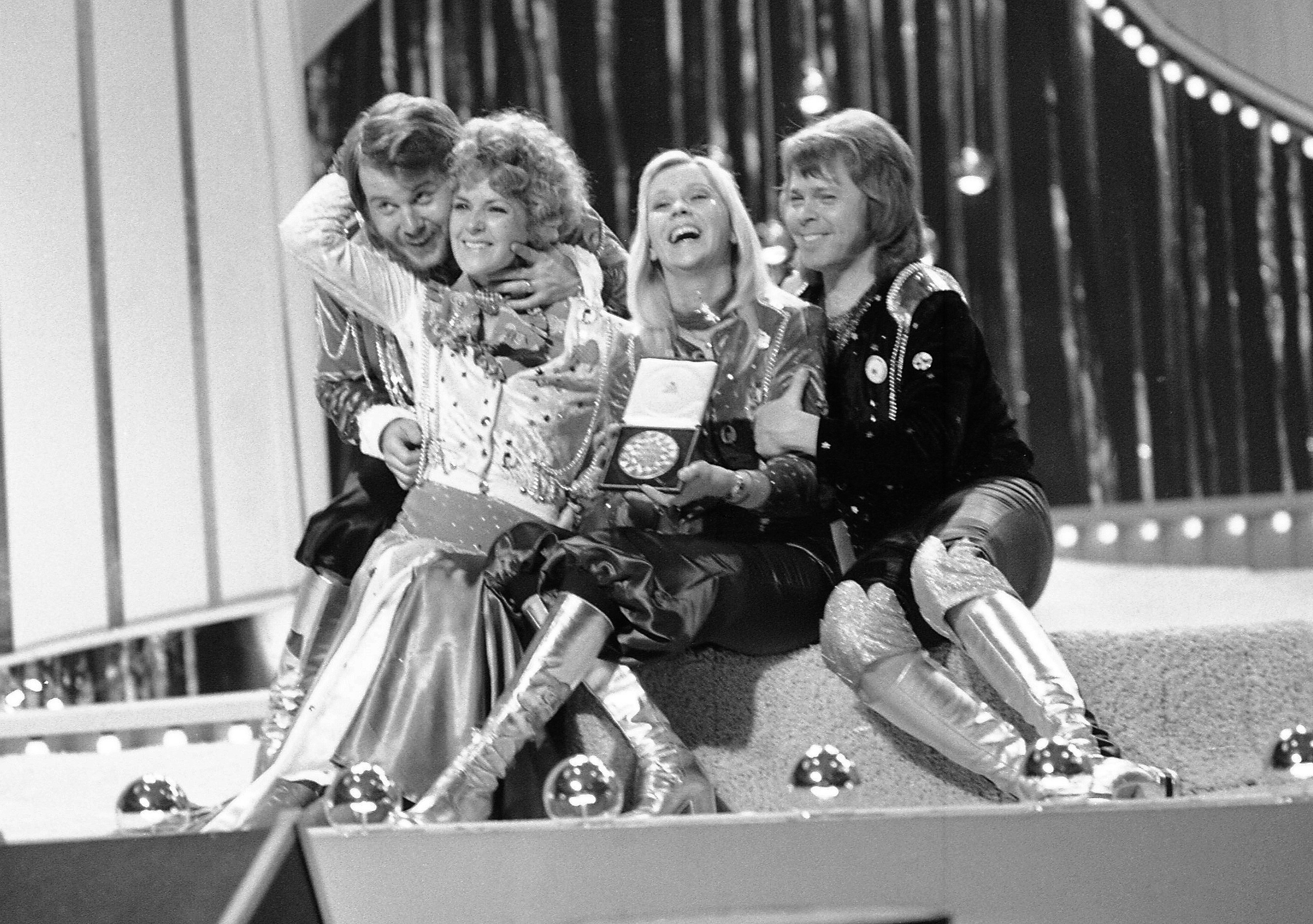 Swedish pop group ABBA celebrate after winning the 1974 Eurovision Song Contest at the Brighton Dome in England with their song Waterloo. Photo / AP
