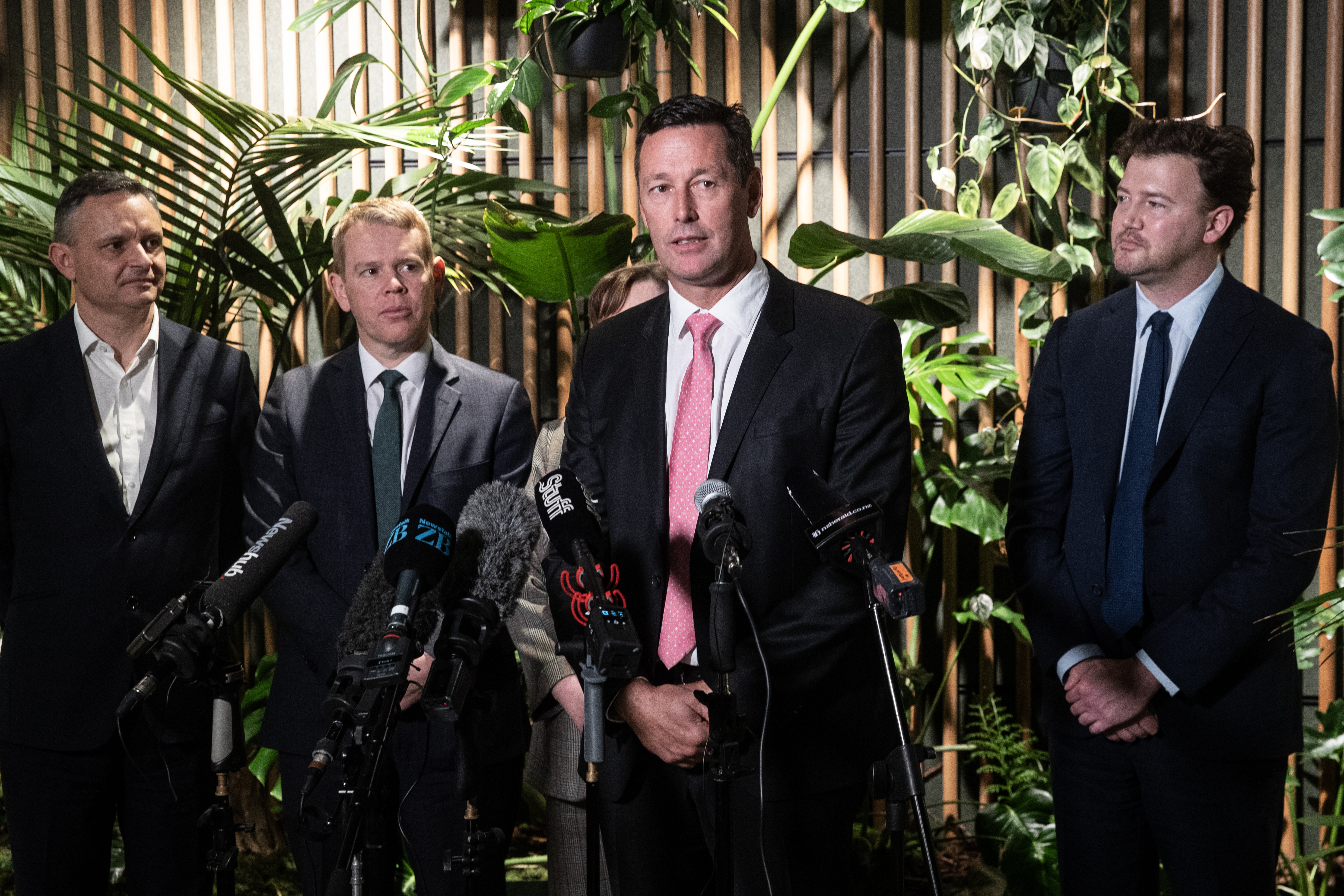 At the BlackRock green energy investment fund announcement: BlackRock's Andrew Landman at the microphone, with (from left) Climate Change Minister James Shaw, Prime Minister Chris Hipkins, Energy Minister Megan Woods (obscured) and BlackRock's Charlie Reid. Photo / Jason Oxenham
