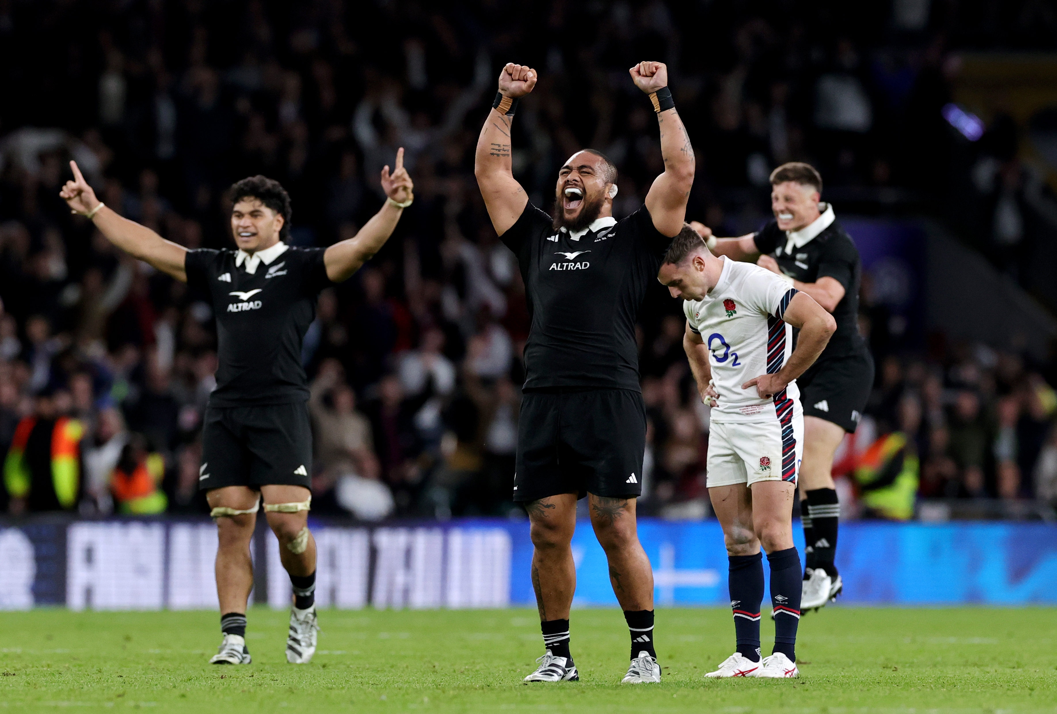 Ofa Tu'ungafasi of the All Blacks celebrates at fulltime as George Ford of England looks dejected. Photo / Getty Images
