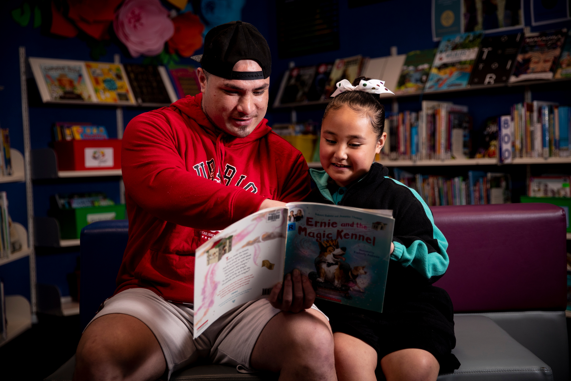 Poutasi Lemuelu with his daughter, Peyton Poutasi (6) who's been making great progress in reading and writing since starting school this year at Robertson Road School in Māngere. Photo / Dean Purcell