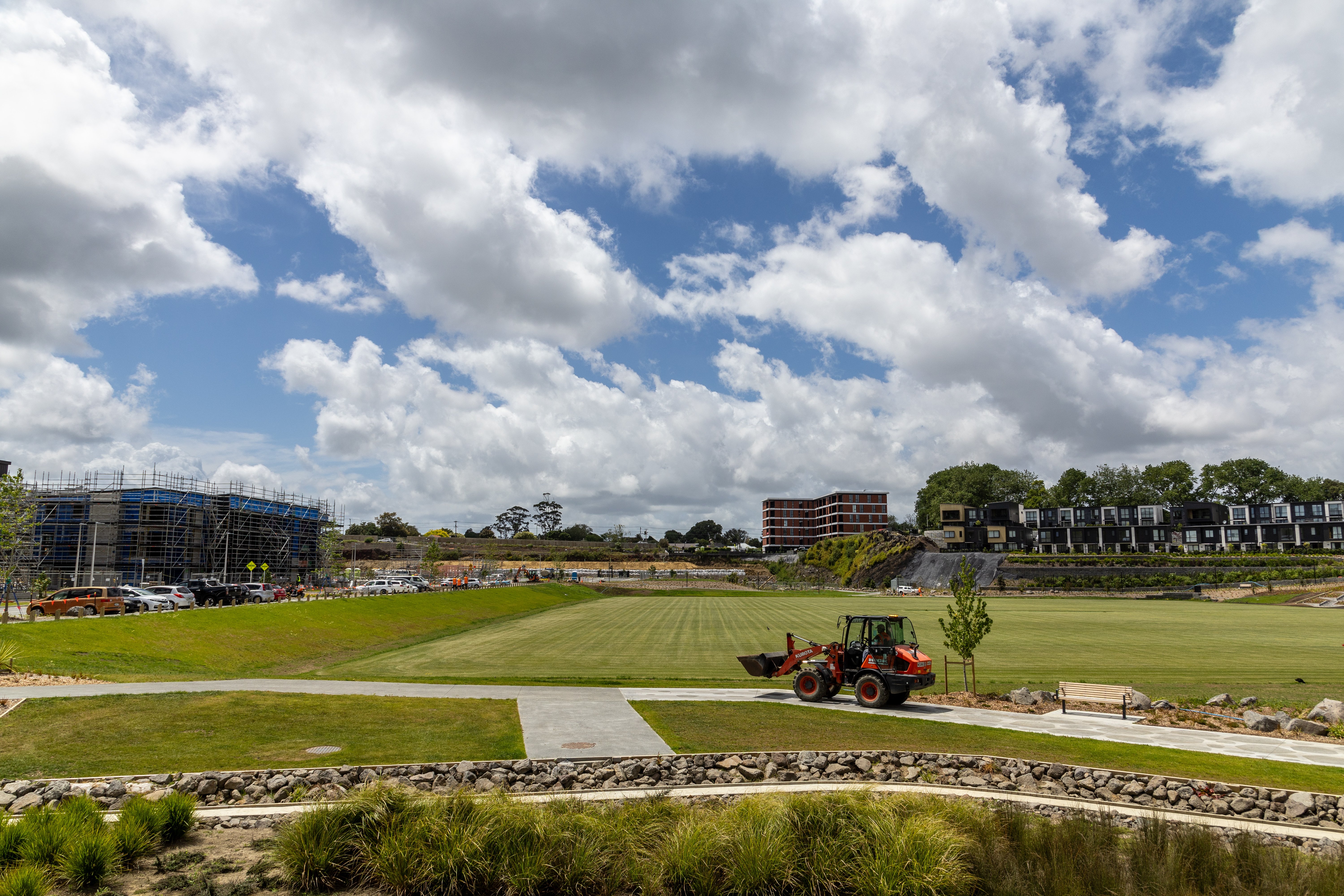 First terrace homes (left) in the heart of the site and the finished Caldera apartments (centre) at the ex-Winstone Quarry off Mt Eden Rd where Fletcher Living is building. Photo / Michael Craig