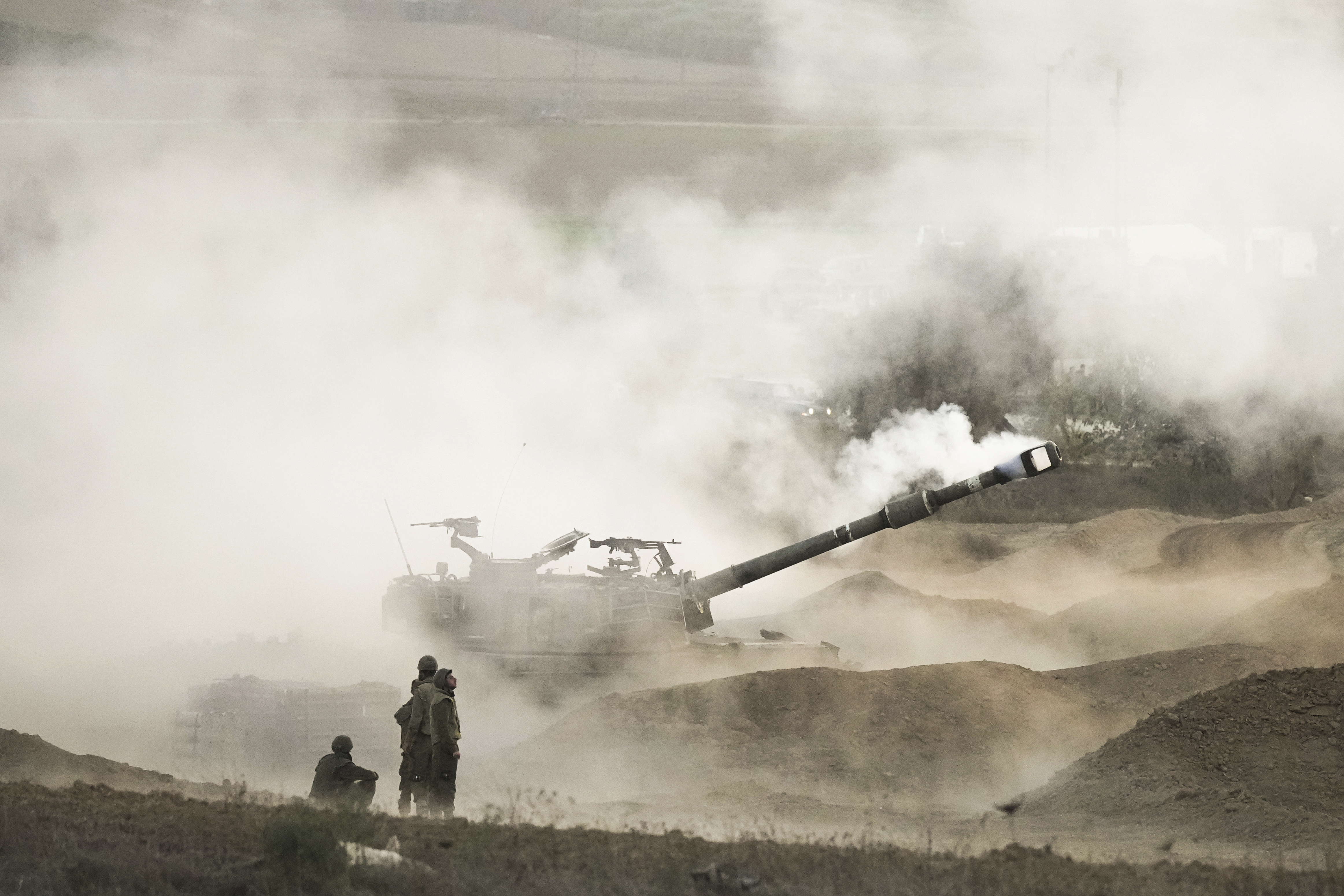 An Israeli mobile artillery unit fires a shell from southern Israel towards the Gaza Strip. Photo / AP