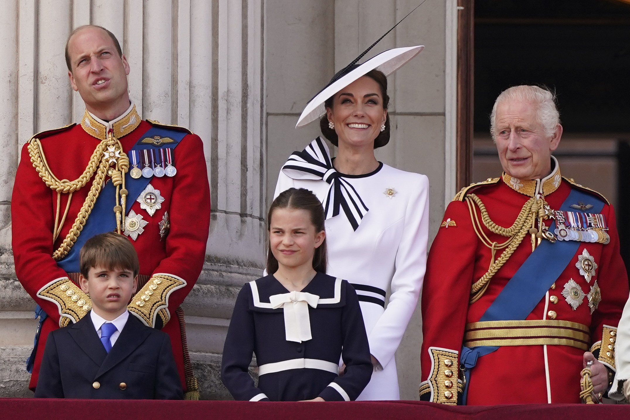 Britain's King Charles III, right, is joined by Prince William, Prince Louis, Princess Charlotte and Kate Princess of Wales on the Balcony at Buckingham Palace after attending the Trooping the Color ceremony, in London, Saturday, June 15, 2024. Trooping the Color is the King's Birthday Parade and one of the nation's most impressive and iconic annual events attended by almost every member of the Royal Family. (AP Photo/Alberto Pezzali)