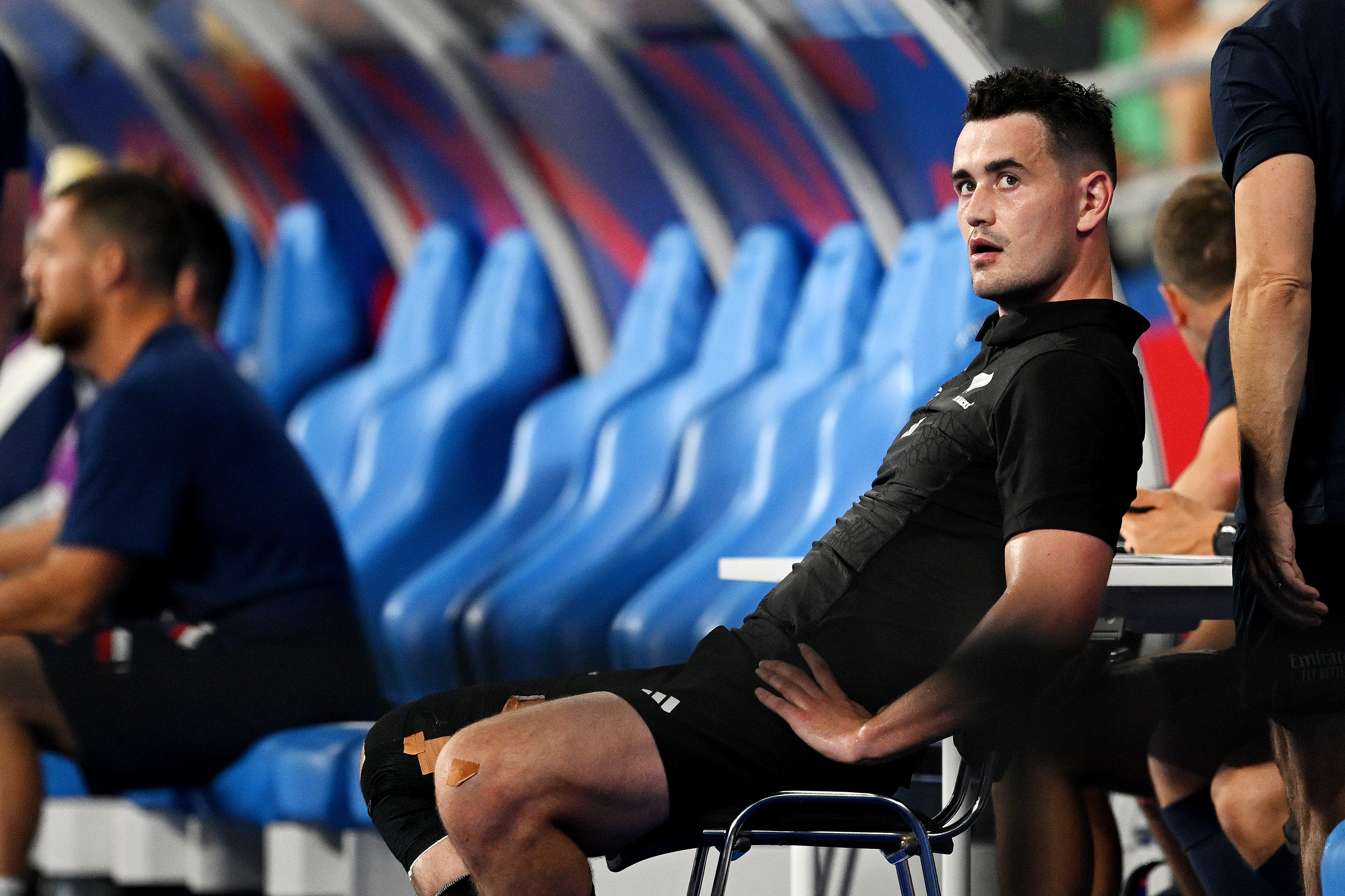 Will Jordan  sits dejected as he is sin binned during the Rugby World Cup France 2023 Pool A match against France. Photo / Getty Images